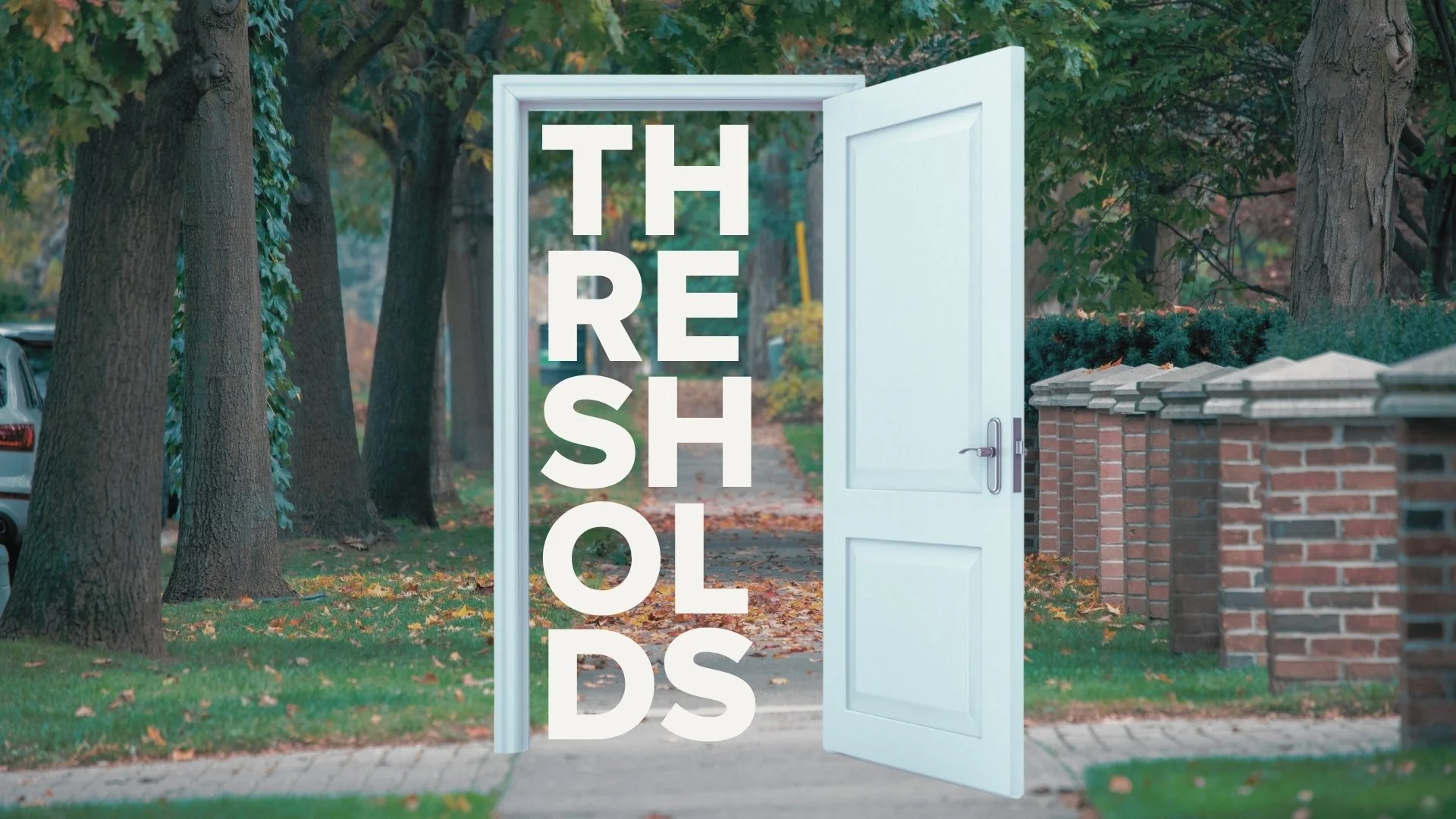 A white open door standing on a sidewalk with trees and a brick wall in the background, overlaid with the text 'THE REBUILD SHOP' in large white letters.