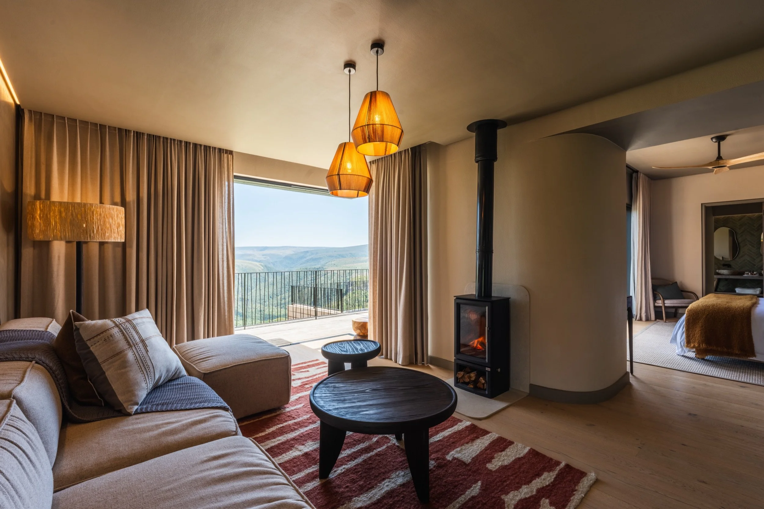 Suite lounge with fireplace at Hiddn