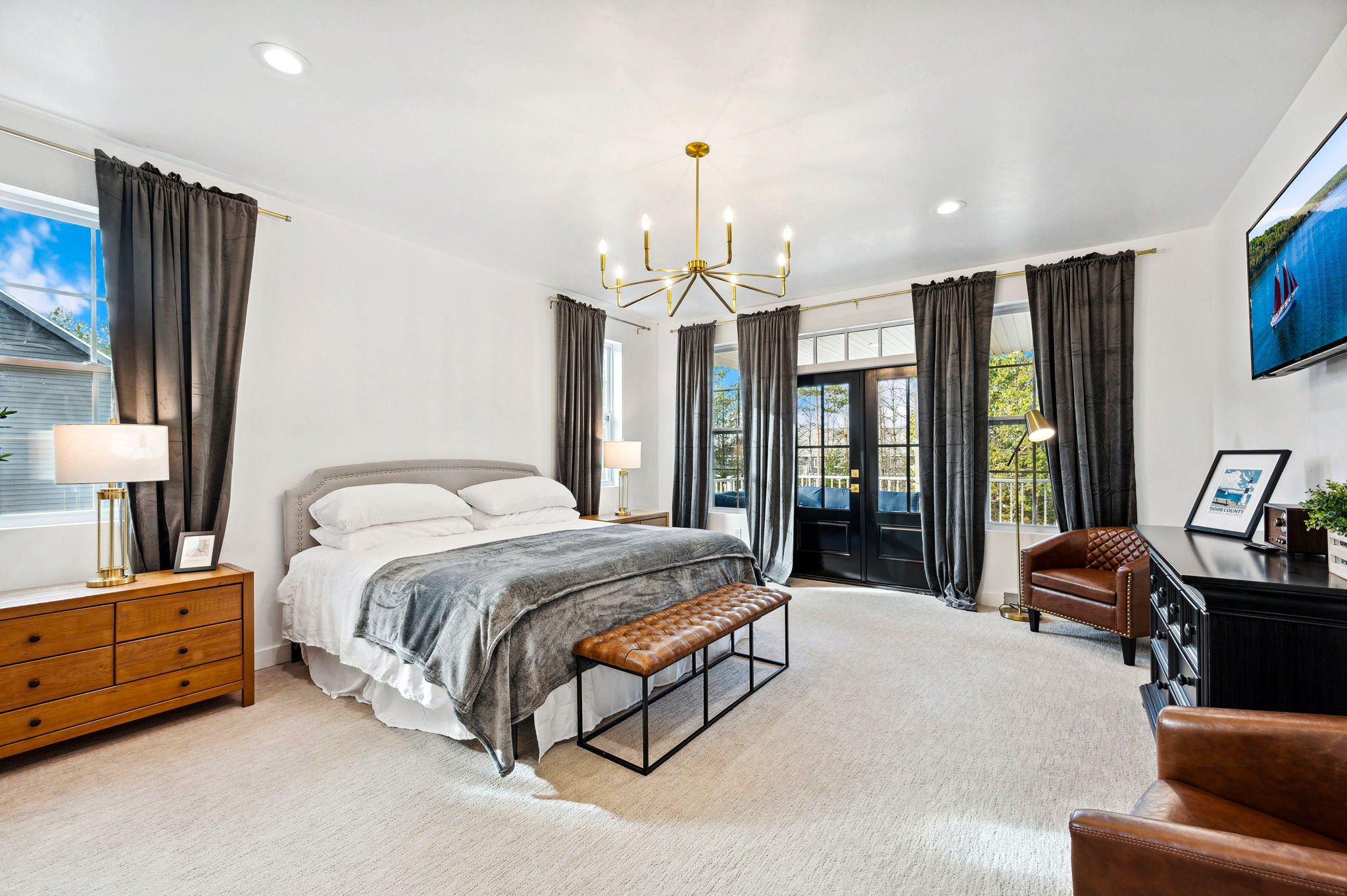 Experience the serenity of your Master Suite, boasting a king-sized bed, surrounded by chic leather seating, and a 55" 4K Smart TV invites you to relax at the end of your day while you plan tomorrow's adventures.