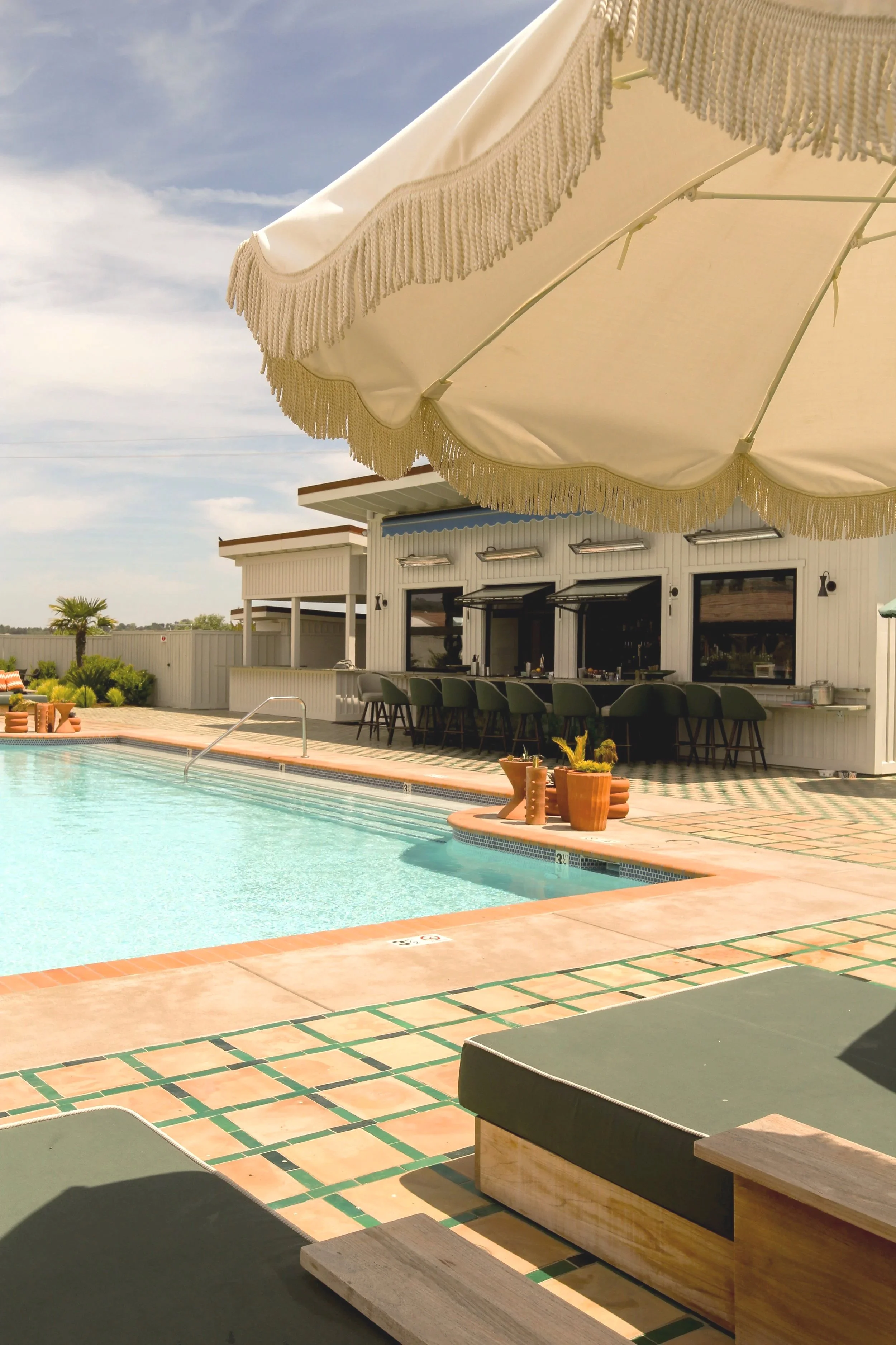 Poolside lounge seating at River Lodge Paso Robles wine country hotel with cal-italian bites at Ciao Papi. Always al fresco.