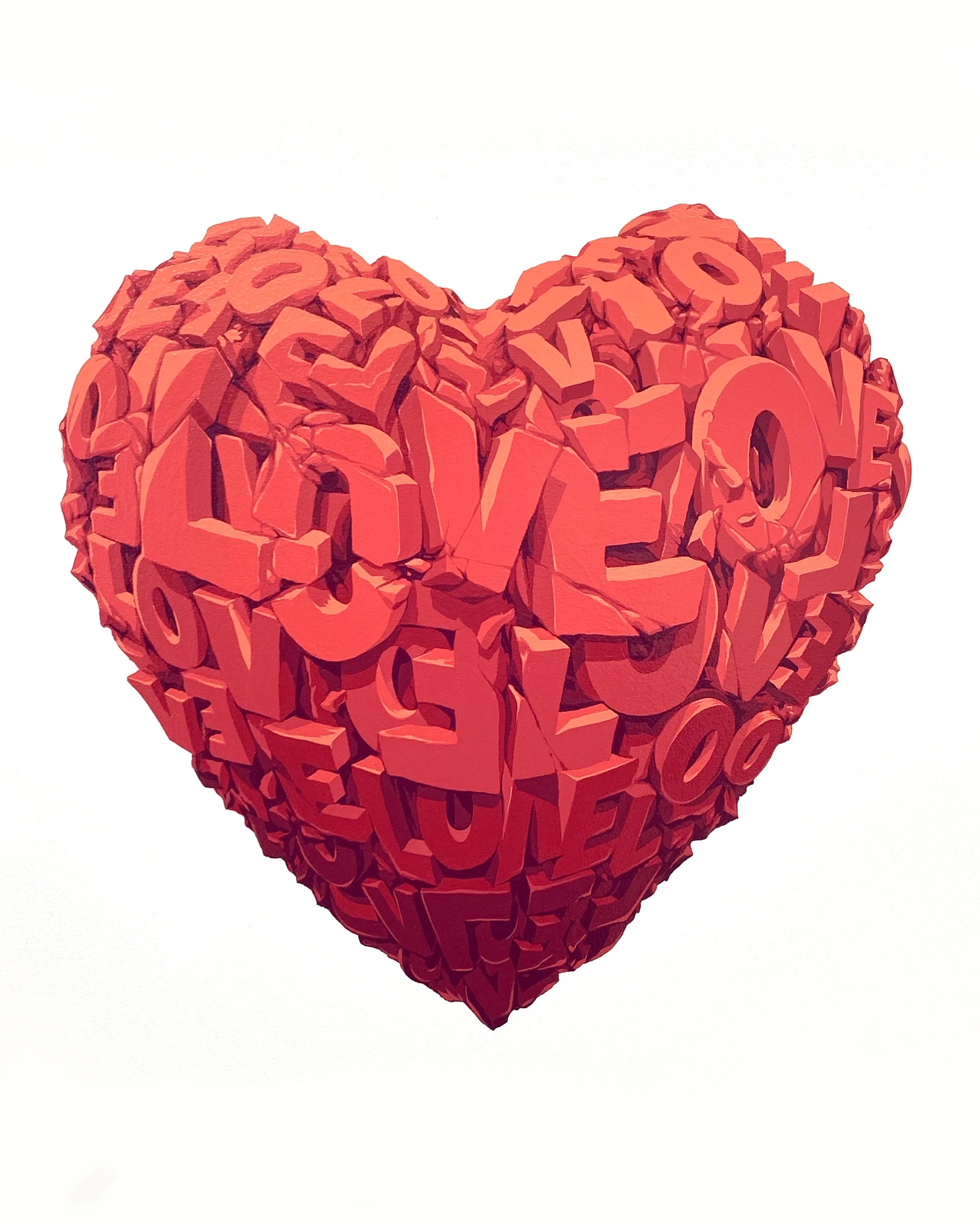 A heart-shaped sculpture made of red, three-dimensional letters from the alphabet, arranged to form a compact and textured surface.