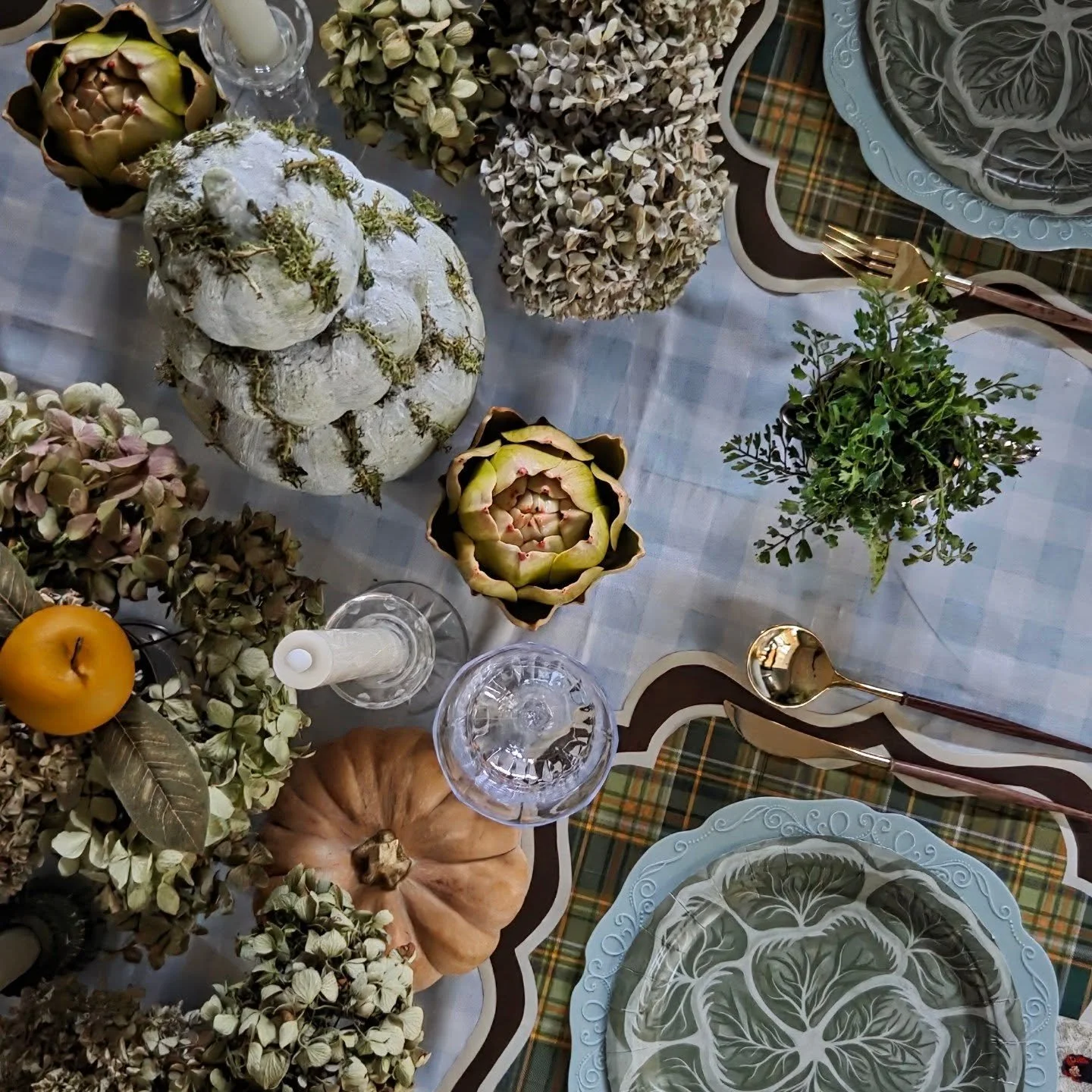Mad for plaid this fall. One of my favorite tips for tablescape design is taking traditional elements and giving them a fun or modern twist. The plaid in my custom paper placemats and the gingham table topper separately are pretty traditional, but la