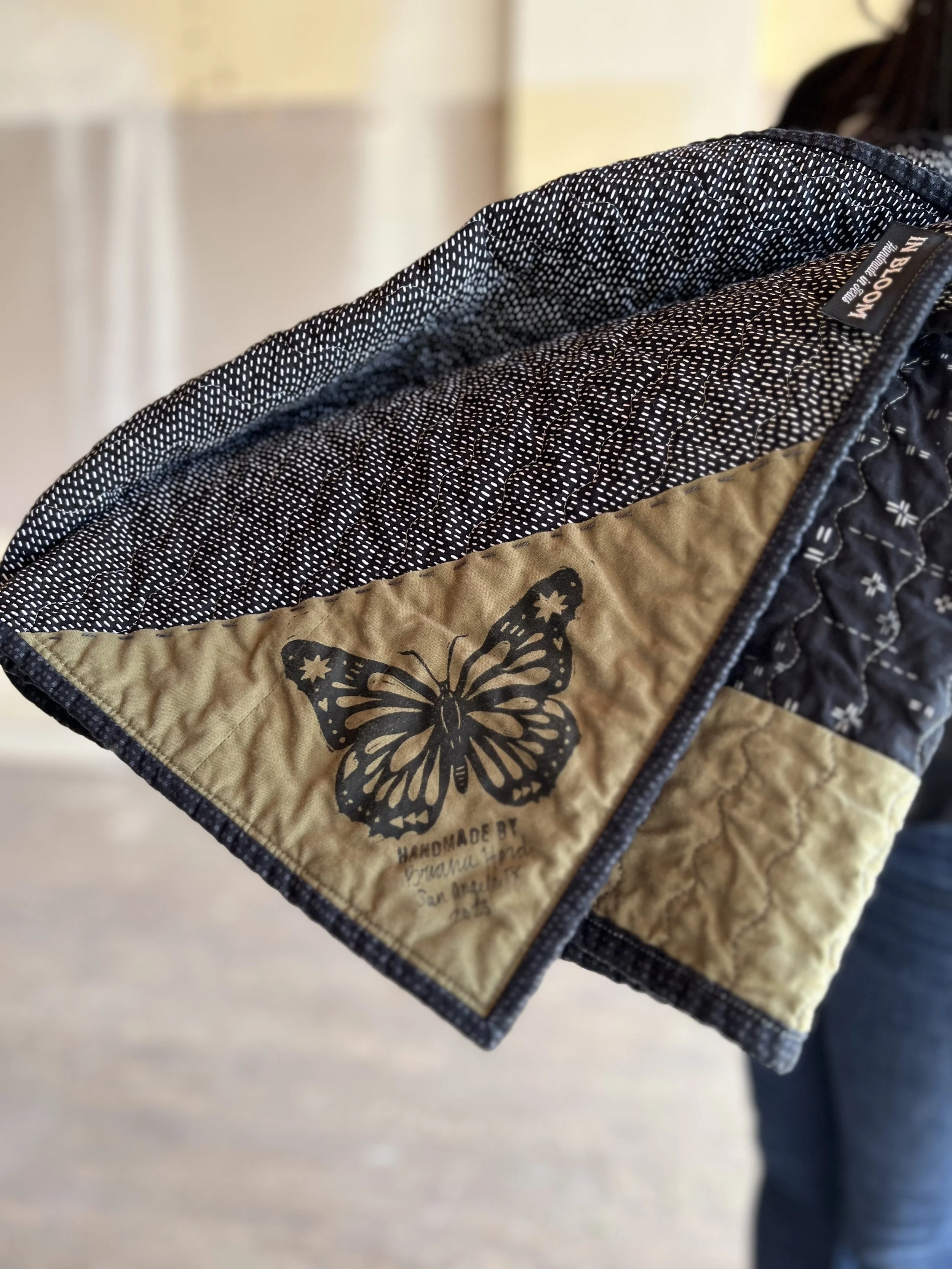A hand-carved stamp label on Bri's Scout Quilt