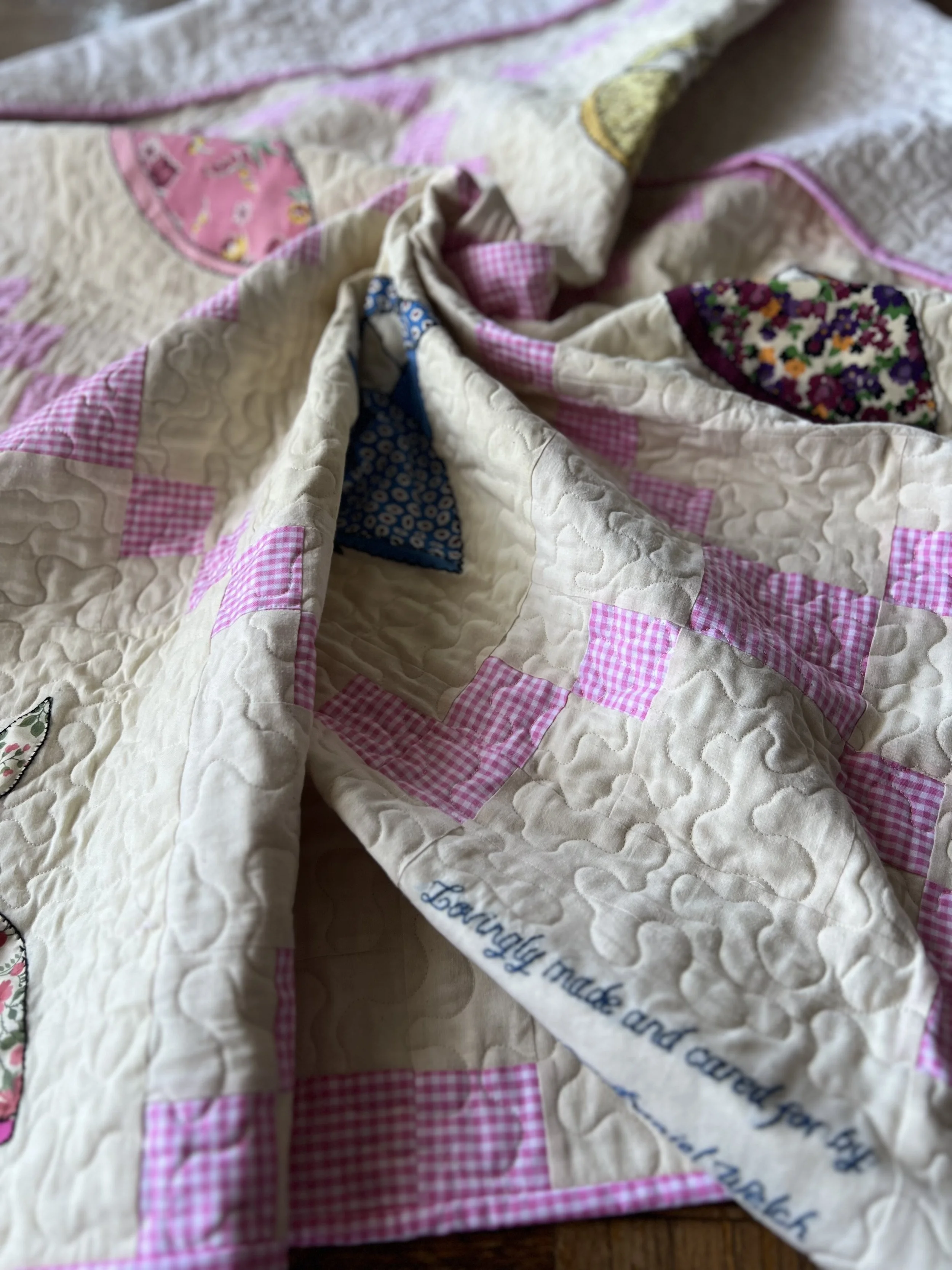 Embroidered quilt block with quilt information