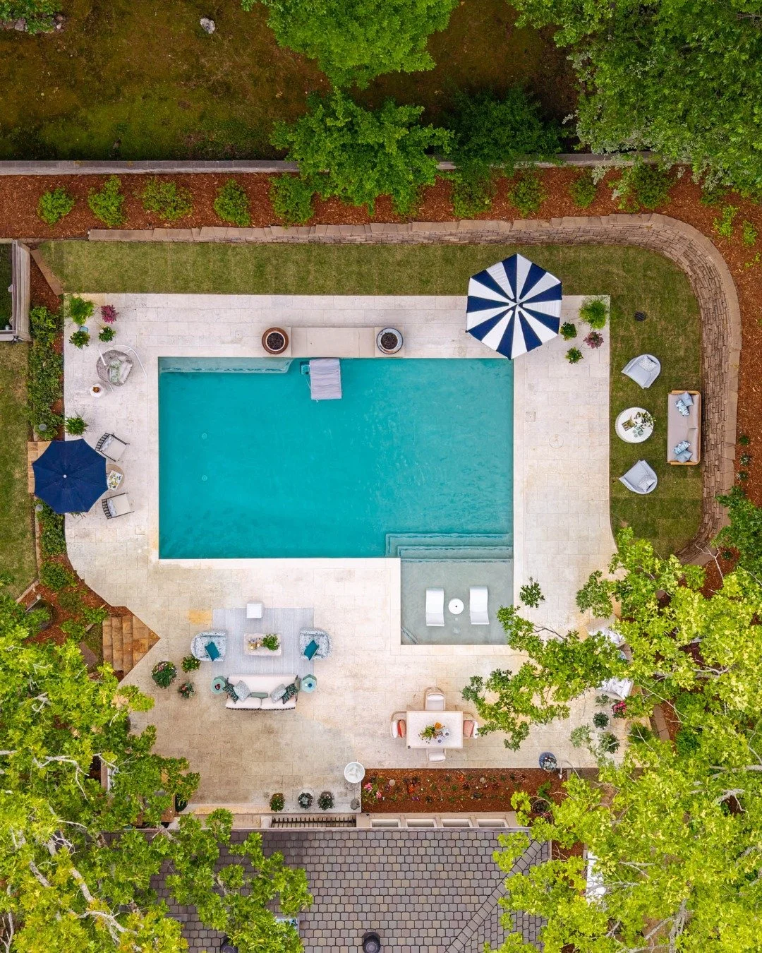 Garden meets poolside 🌿☀️

The Arkansas sun is doing its thing, and this kind of heat calls for an afternoon spent in (or by) the pool - cold drink in hand and nowhere to be.

We layered this space with a touch of European flair, choosing pieces tha