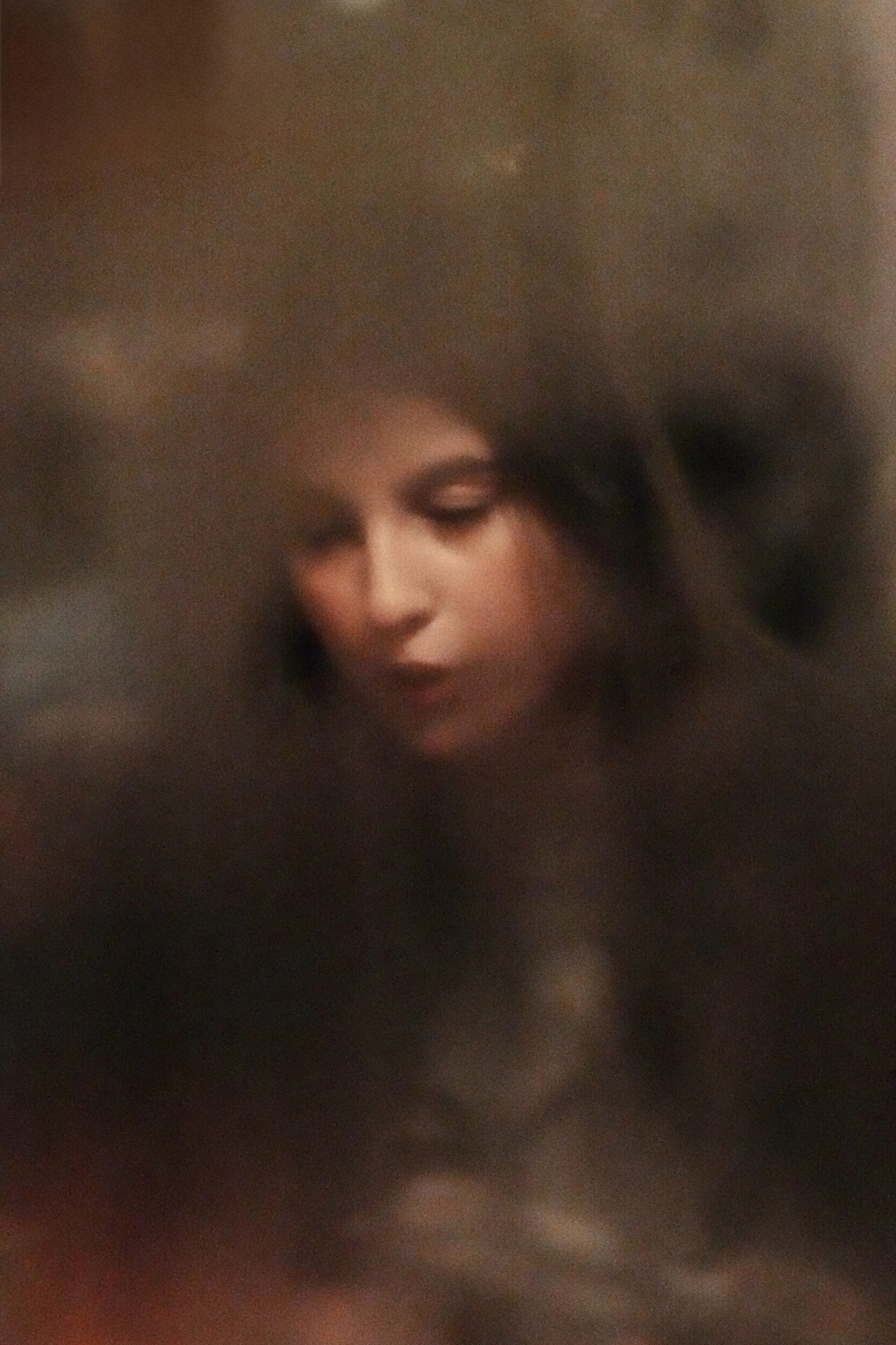 Mona Luna (candid) night photo behind the foggy window on a winter night. No Photoshop or Lightroom, simply a bit of adjustment through the standard photo app of the MacBook 