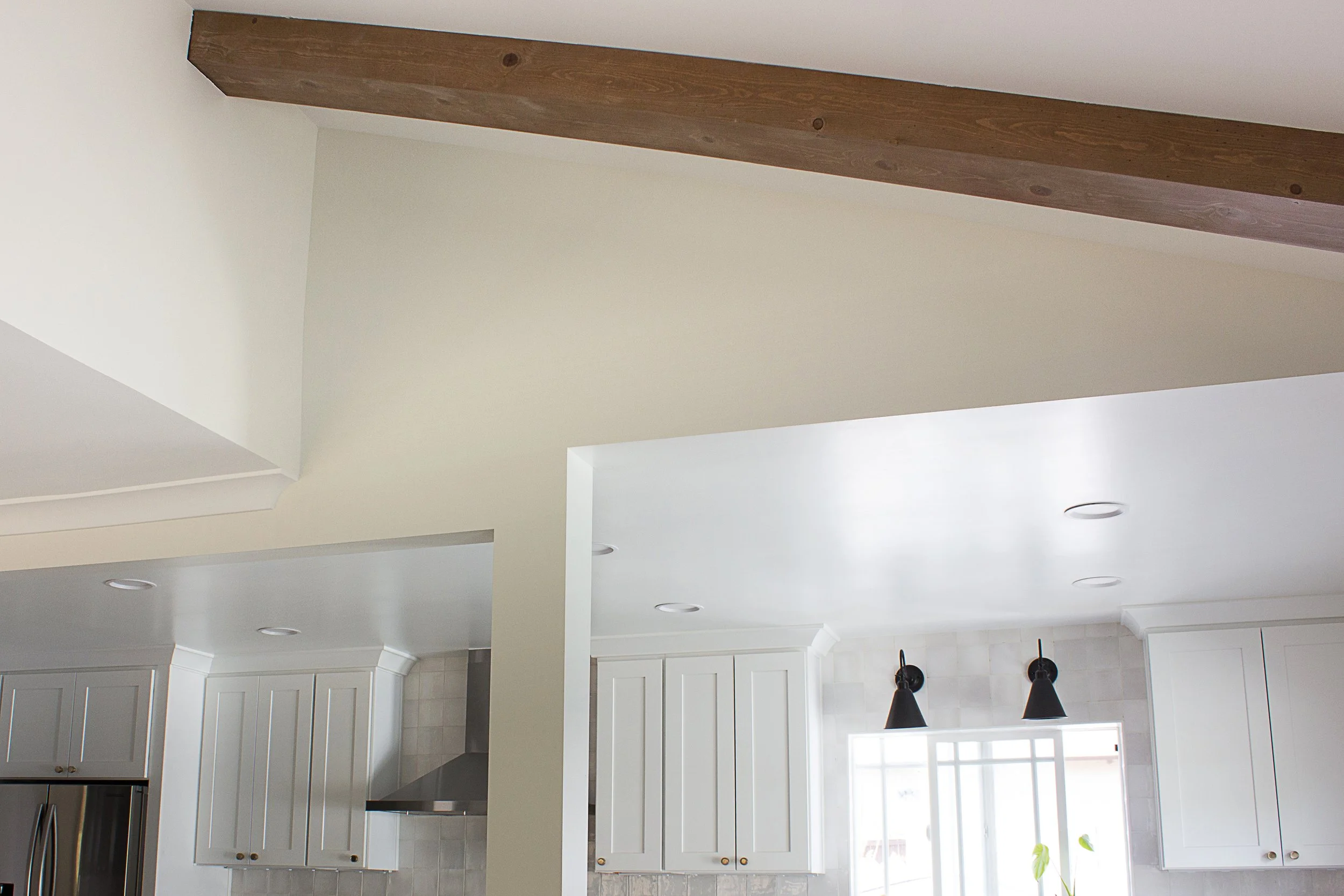 View of the living room and kitchen ceiling