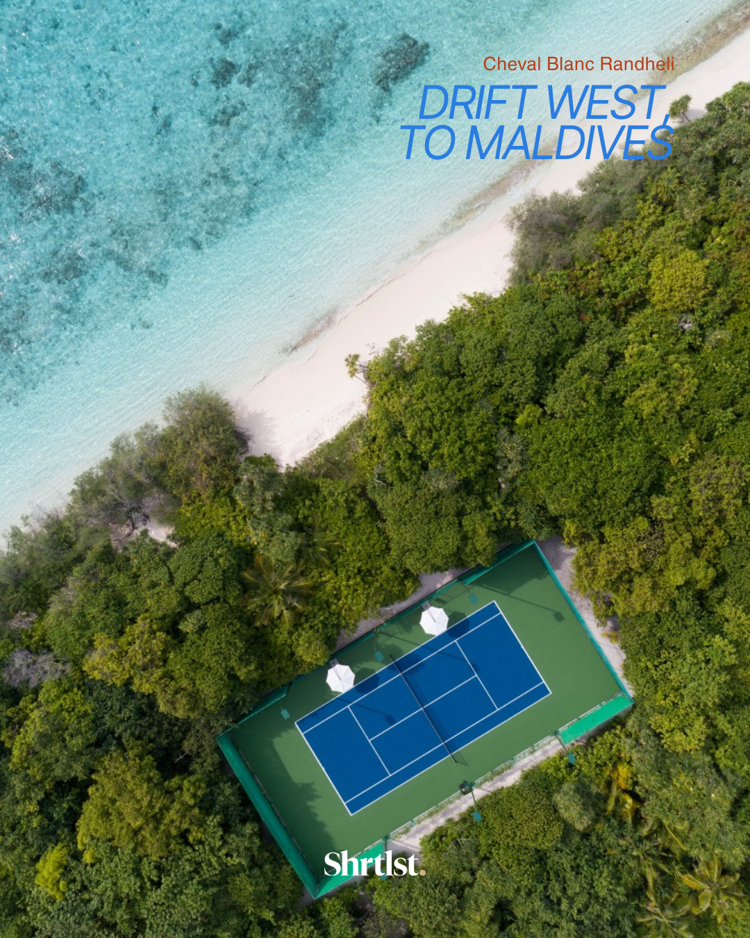 Aerial view of a tropical beach with clear blue water, white sand, lush green trees, and a tennis court with blue surface and white lines.