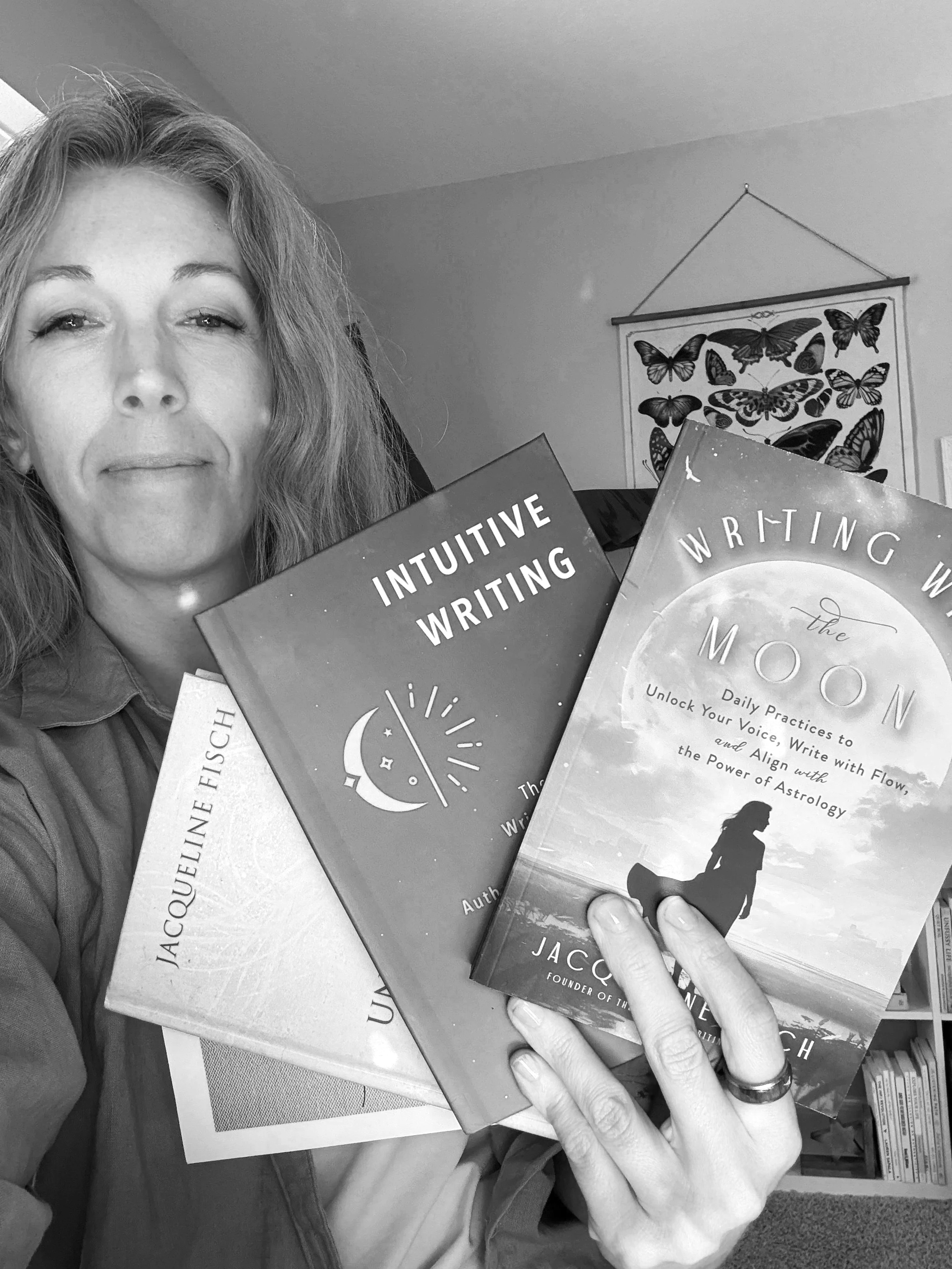 Jacqueline Fisch and intuitive writing partner laptop and coffee in black and white