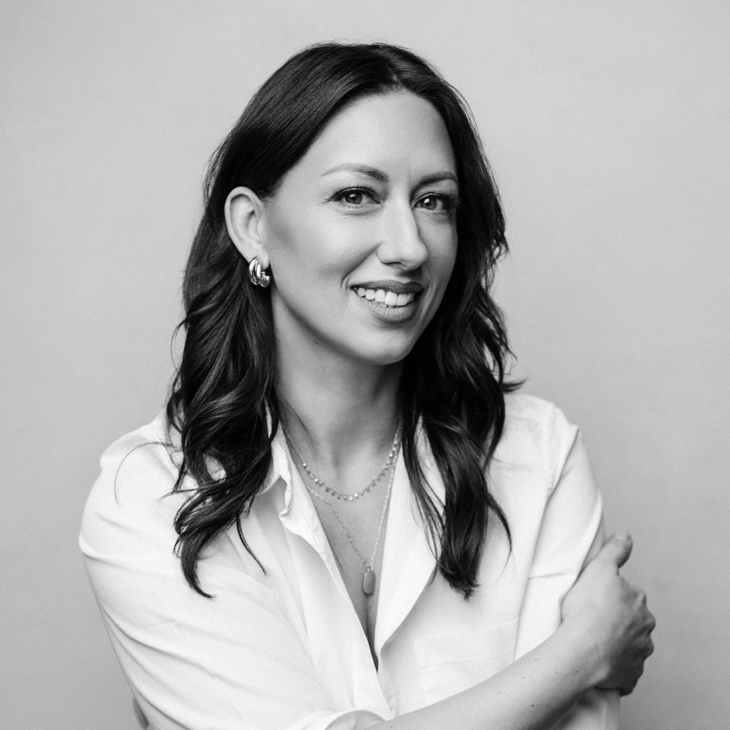 Kim Wensel, author wearing a white collared shirt