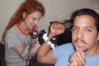 David Blaine getting his logo tattooed by Ronda showin’ off his fresh lip tattoo.