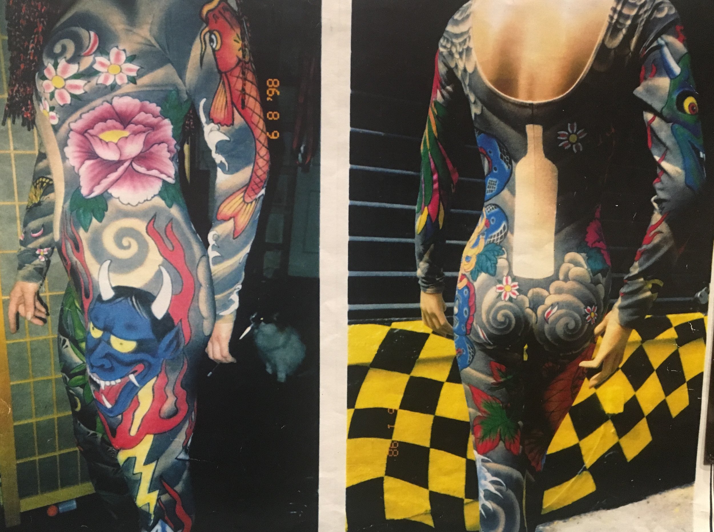 Two mannequins wearing colorful, tattoo-style bodysuits done for Absolute Vodka with designs of images of colorful tattoo-like designs of a koi fish, flower, and demon head.