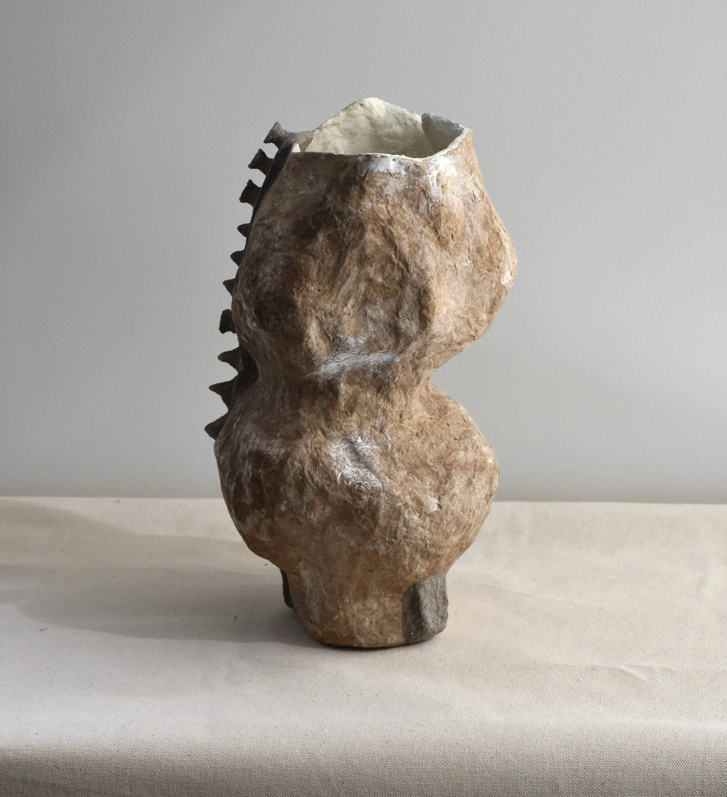 Maya River, Celestial Echoes-O, 2023/24, Recycled paper and gypsum compound, 7 x 7.5 x 11.5 in