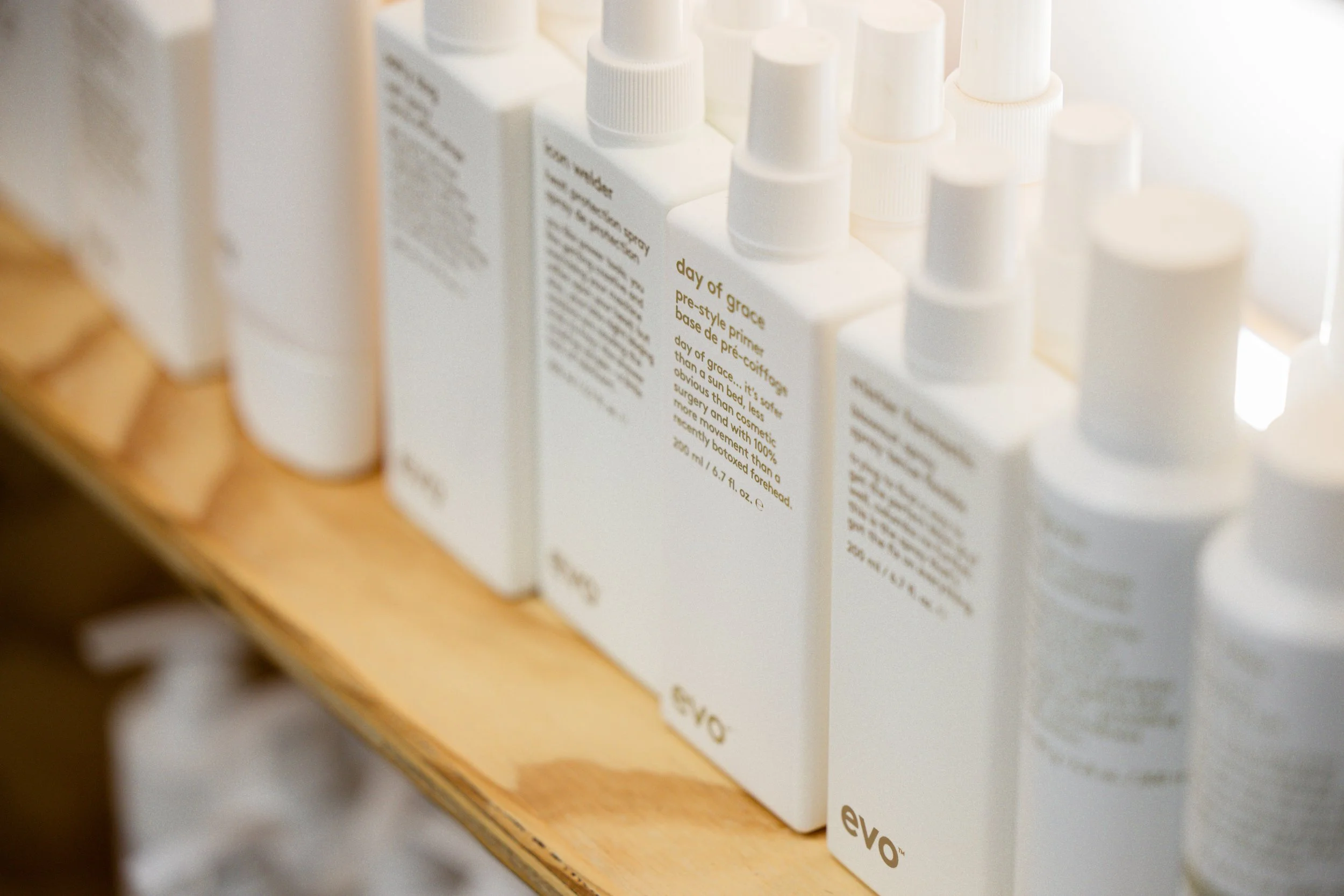 Evo hair care products displayed at Travis Hairdressing, used for styling and hair treatments in the Blackwood salon.