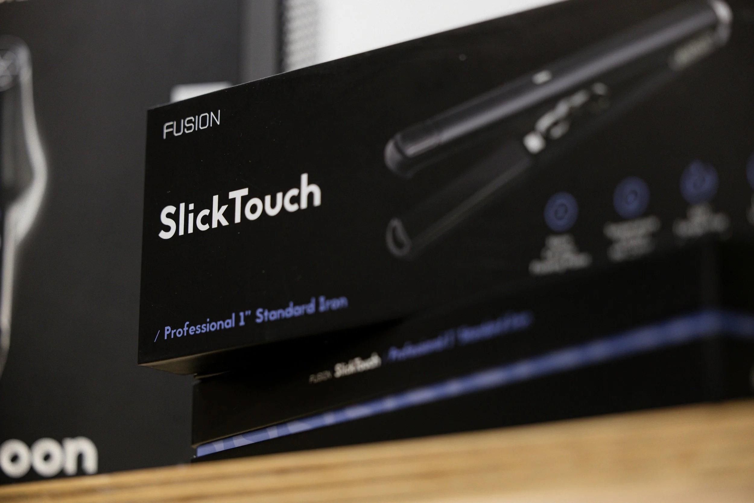 SlickTouch hair styling tool displayed at Travis Hairdressing for smooth salon styling.