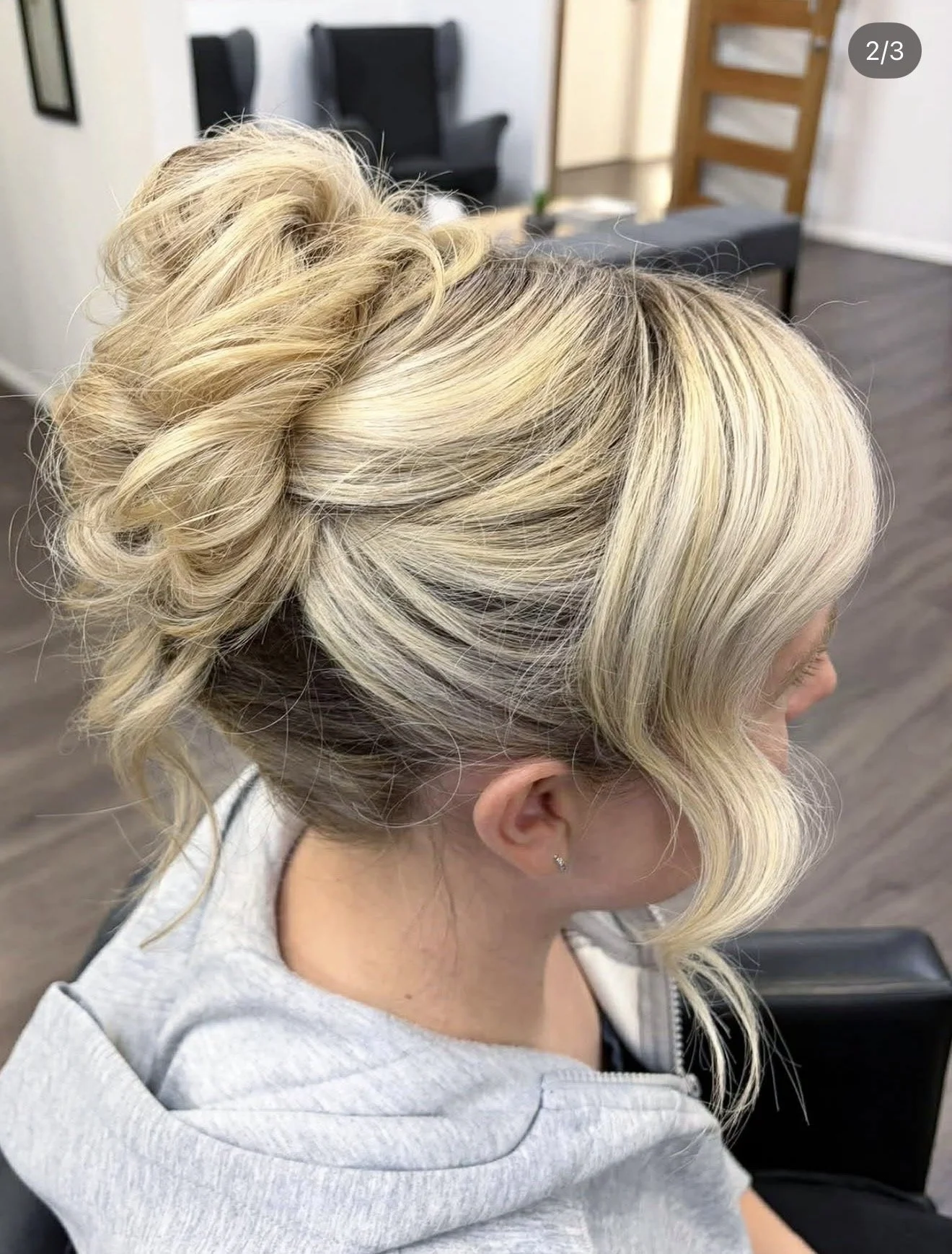 Blonde upstyle with soft face-framing pieces created at Travis Hairdressing for a special occasion.