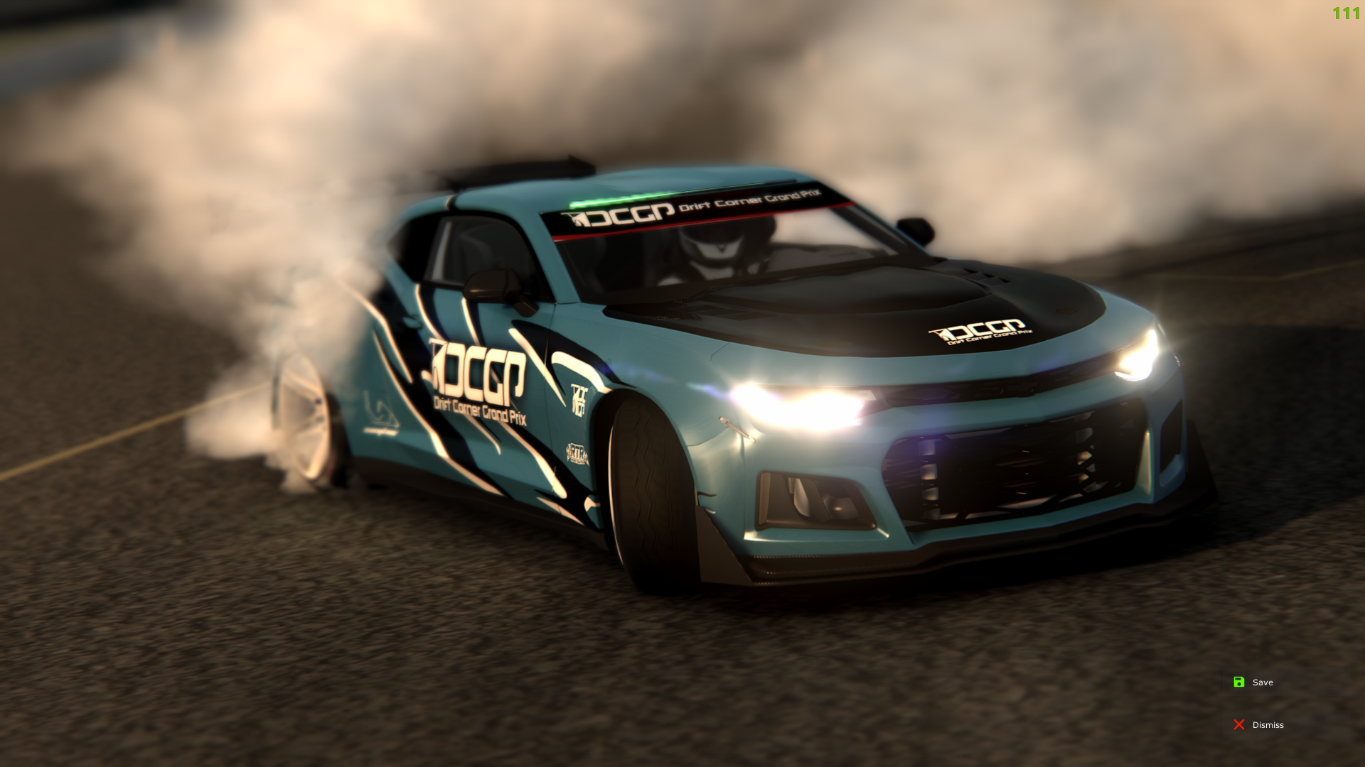 A blue drift car with SCG logo and branding on the side, drifting on a racetrack with smoke coming from the rear tires.
