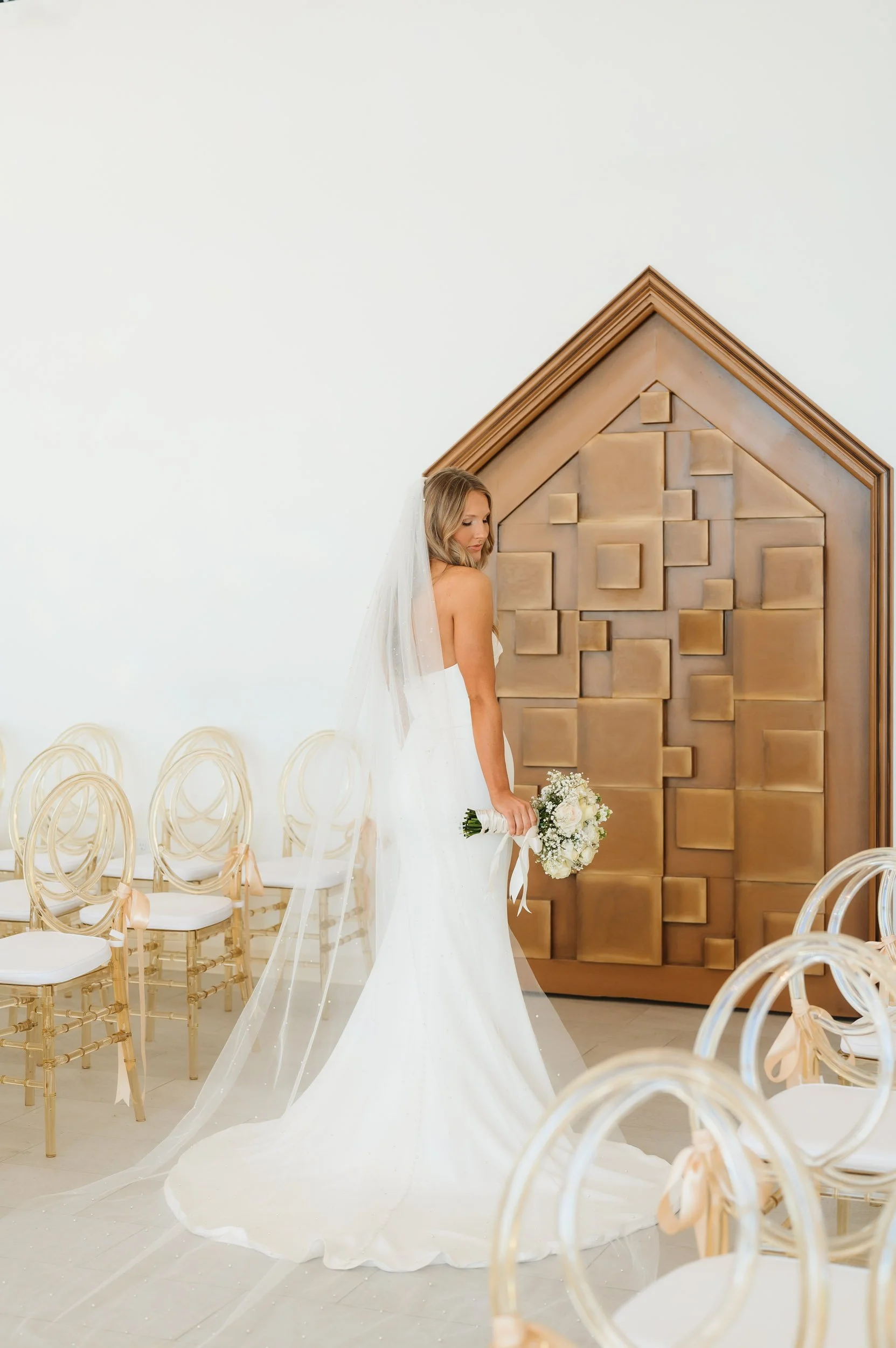 Bride standing together inside chapel wedding venue for bridal portraits