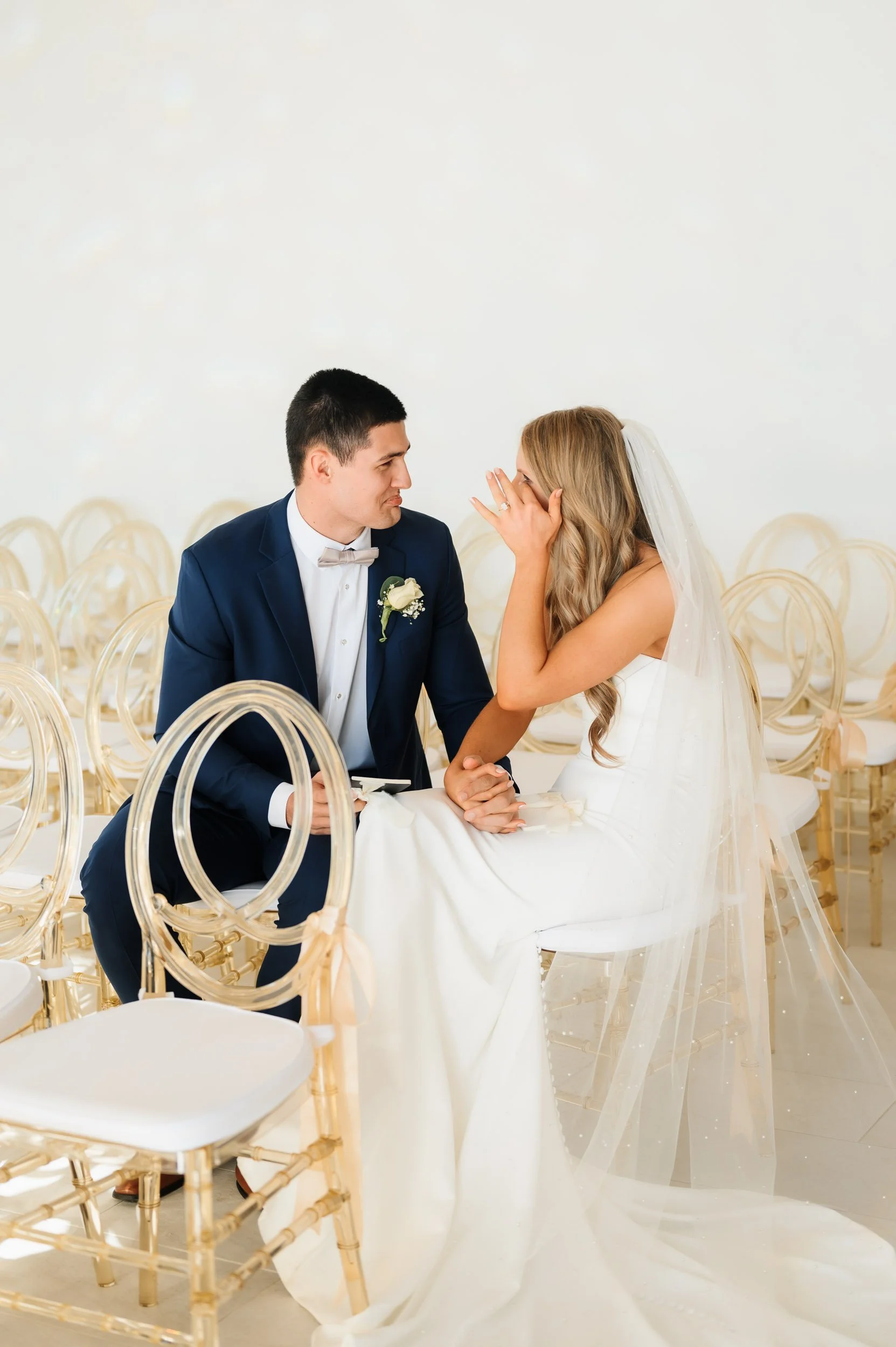 Bride and groom sharing private vows inside elegant chapel wedding venue