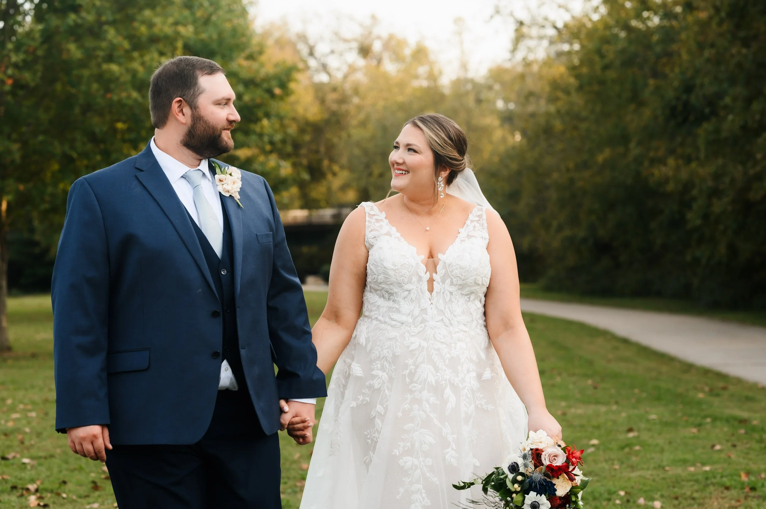 Bride and groom walking outdoors together after wedding ceremony