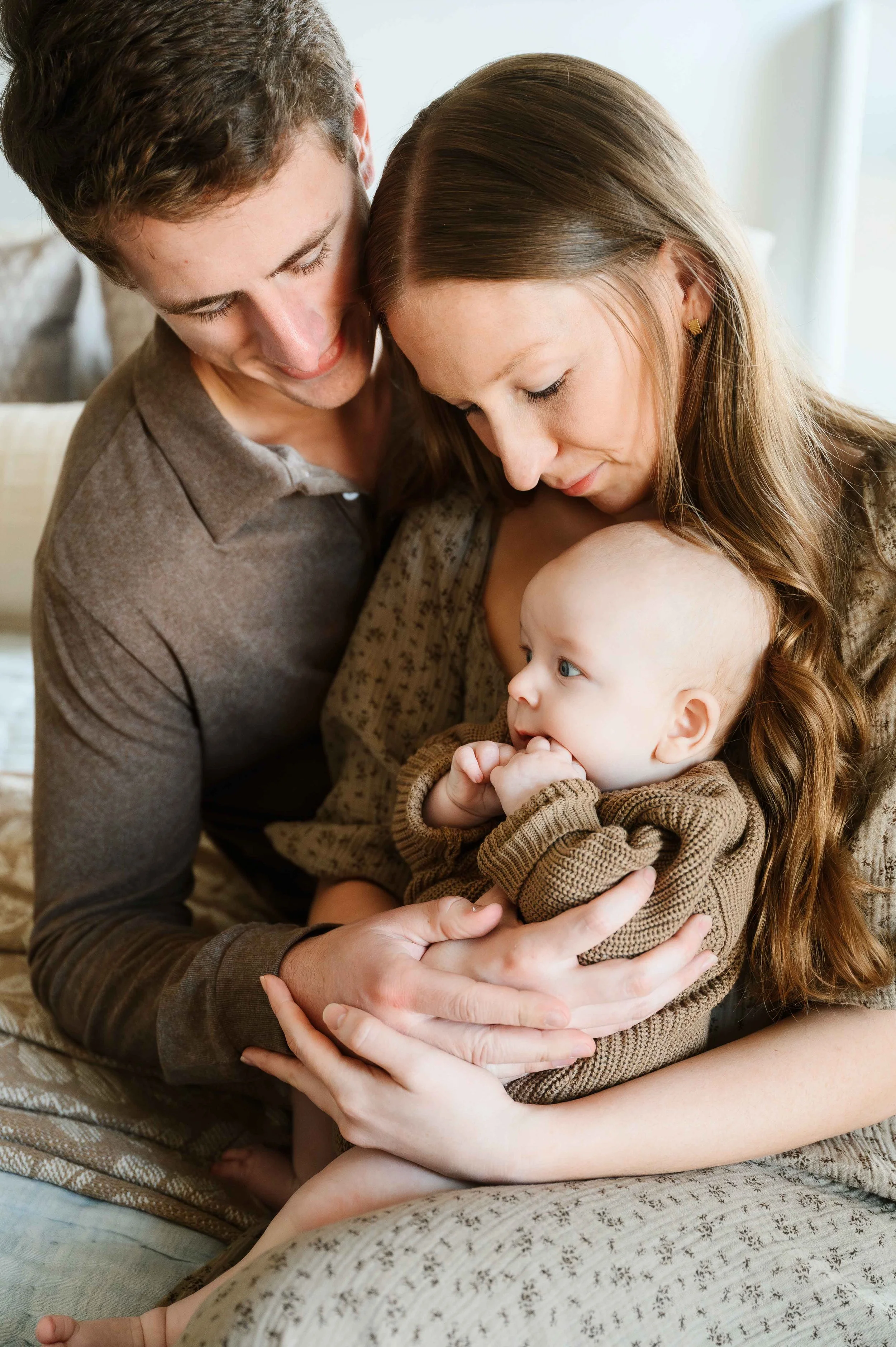 Family session with newborn baby in home with natural light
