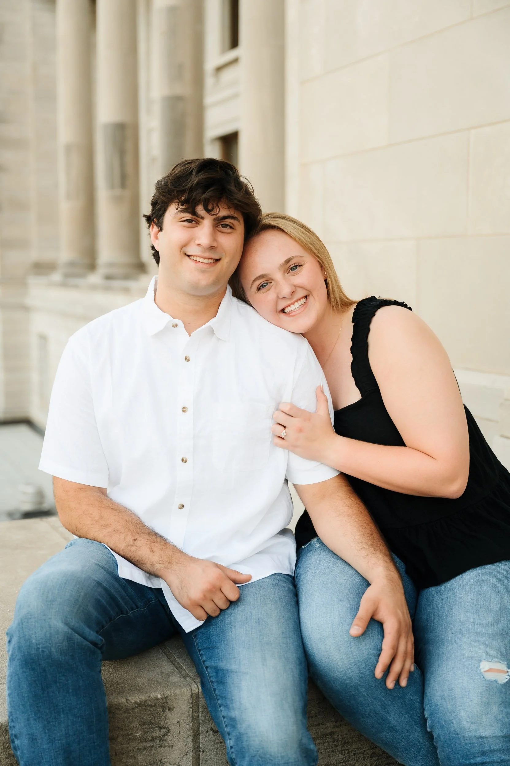 Couple sitting together city during Nashville Tennessee portrait engagement session