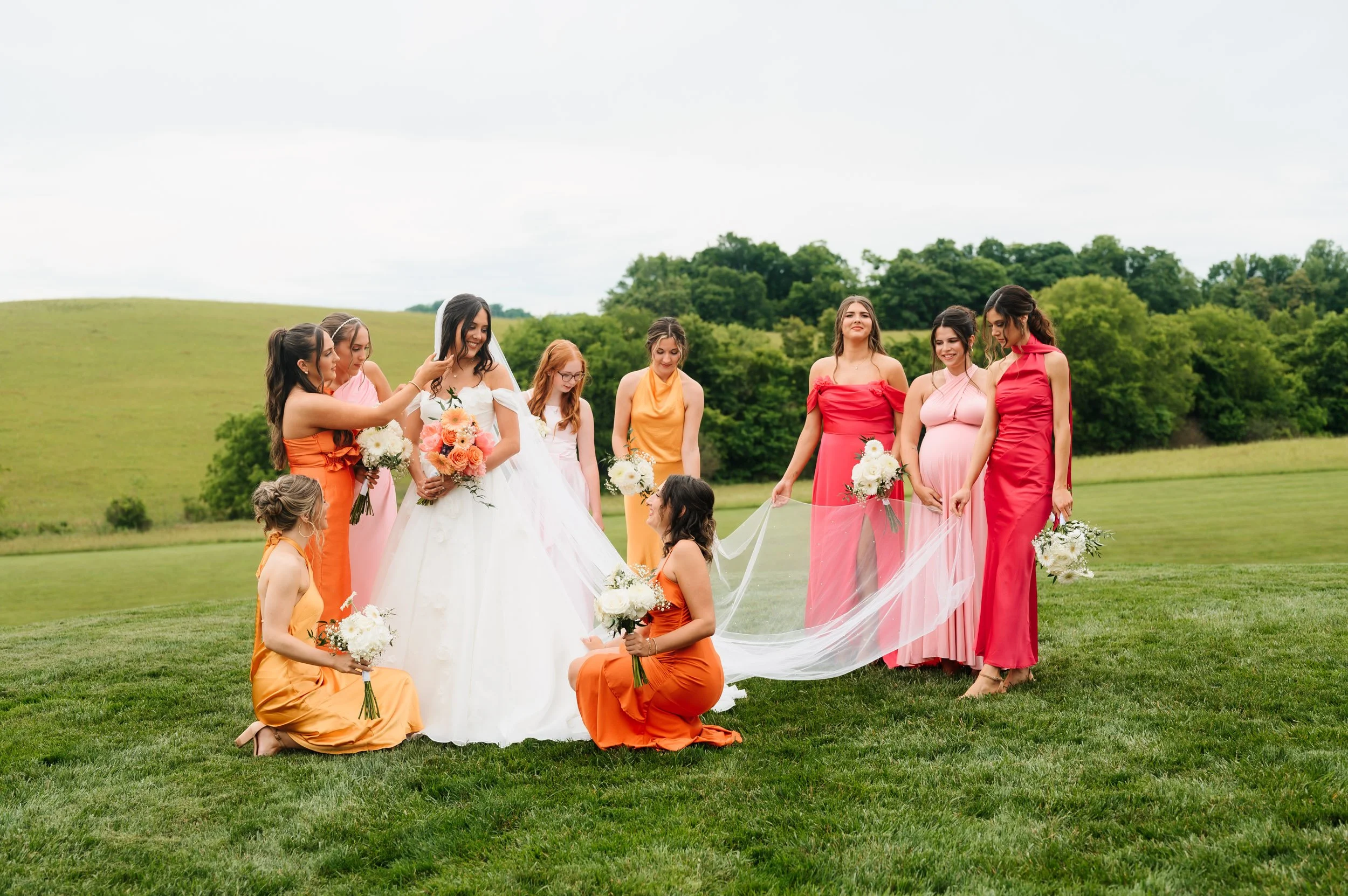 Bridesmaids posing together with bride outdoors during Tennessee wedding day