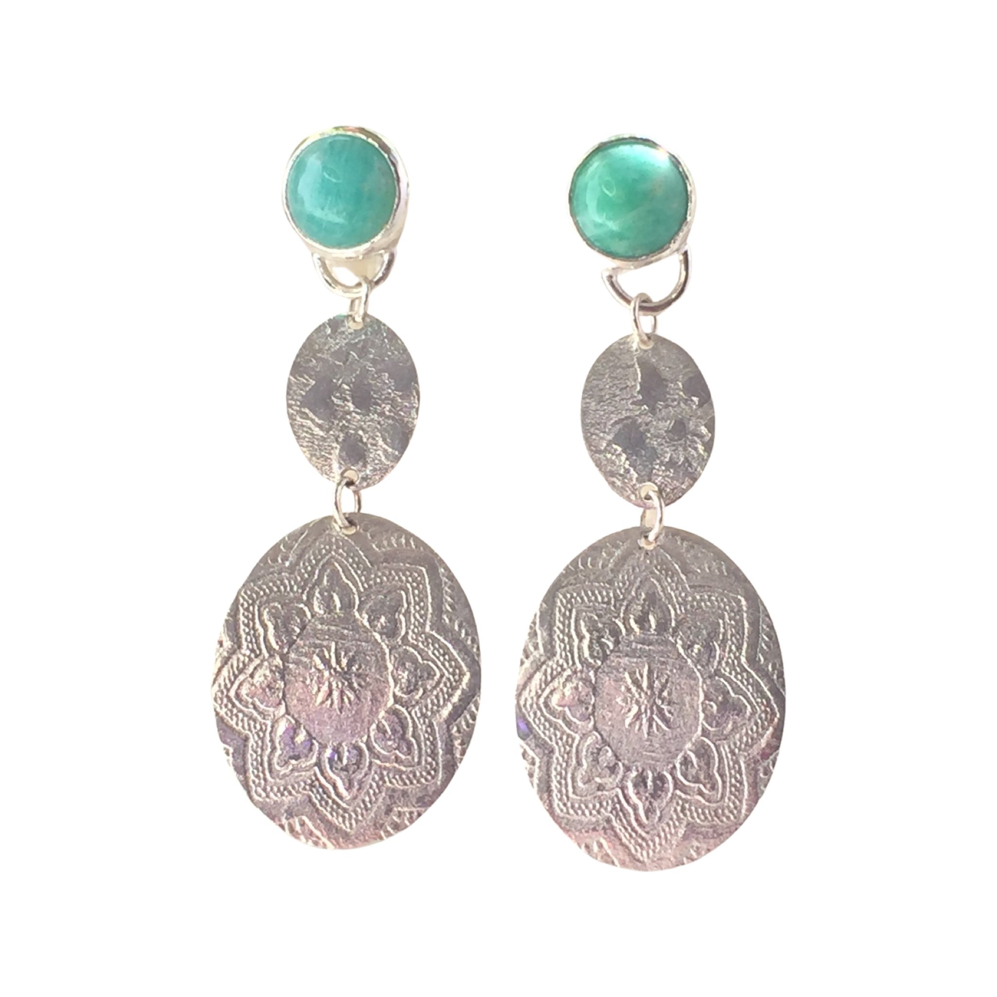 Amazonite gems with silver embossed textured pendants. Sterling silver stud style earrings.