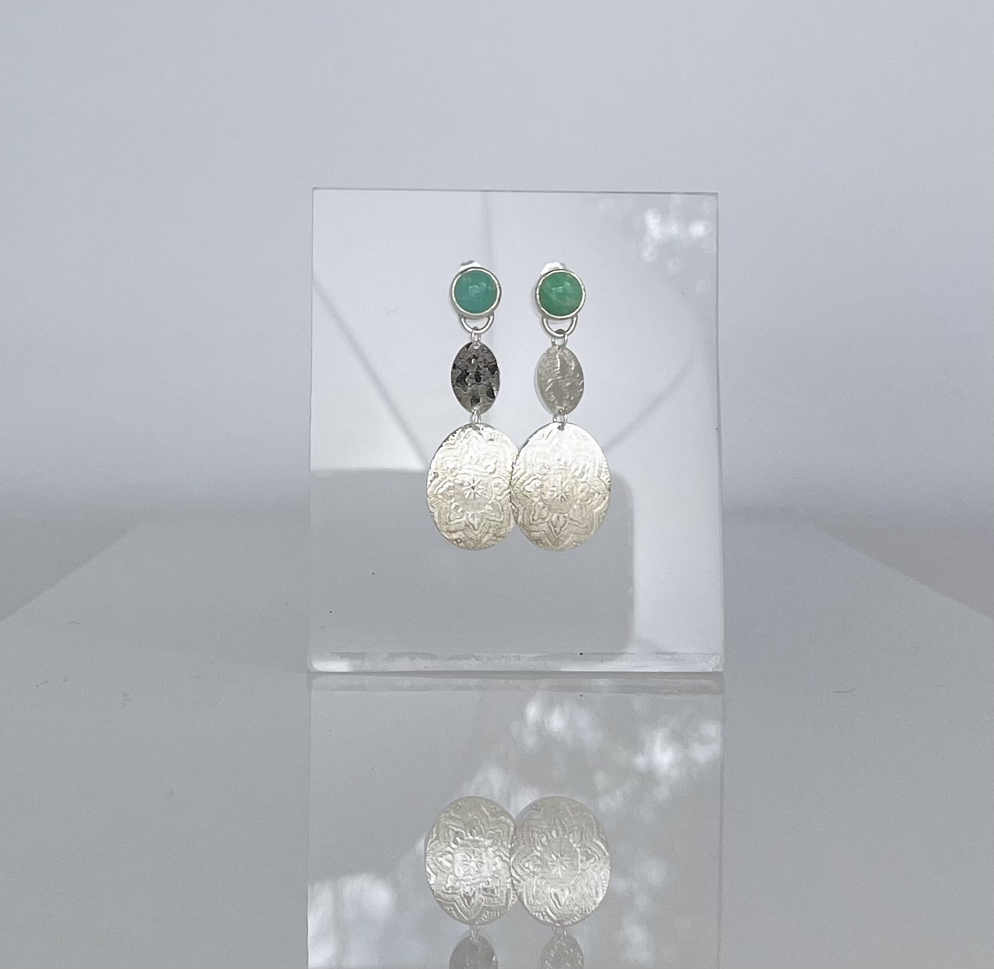 Amazonite gems with silver embossed textured pendants. Sterling silver stud style earrings