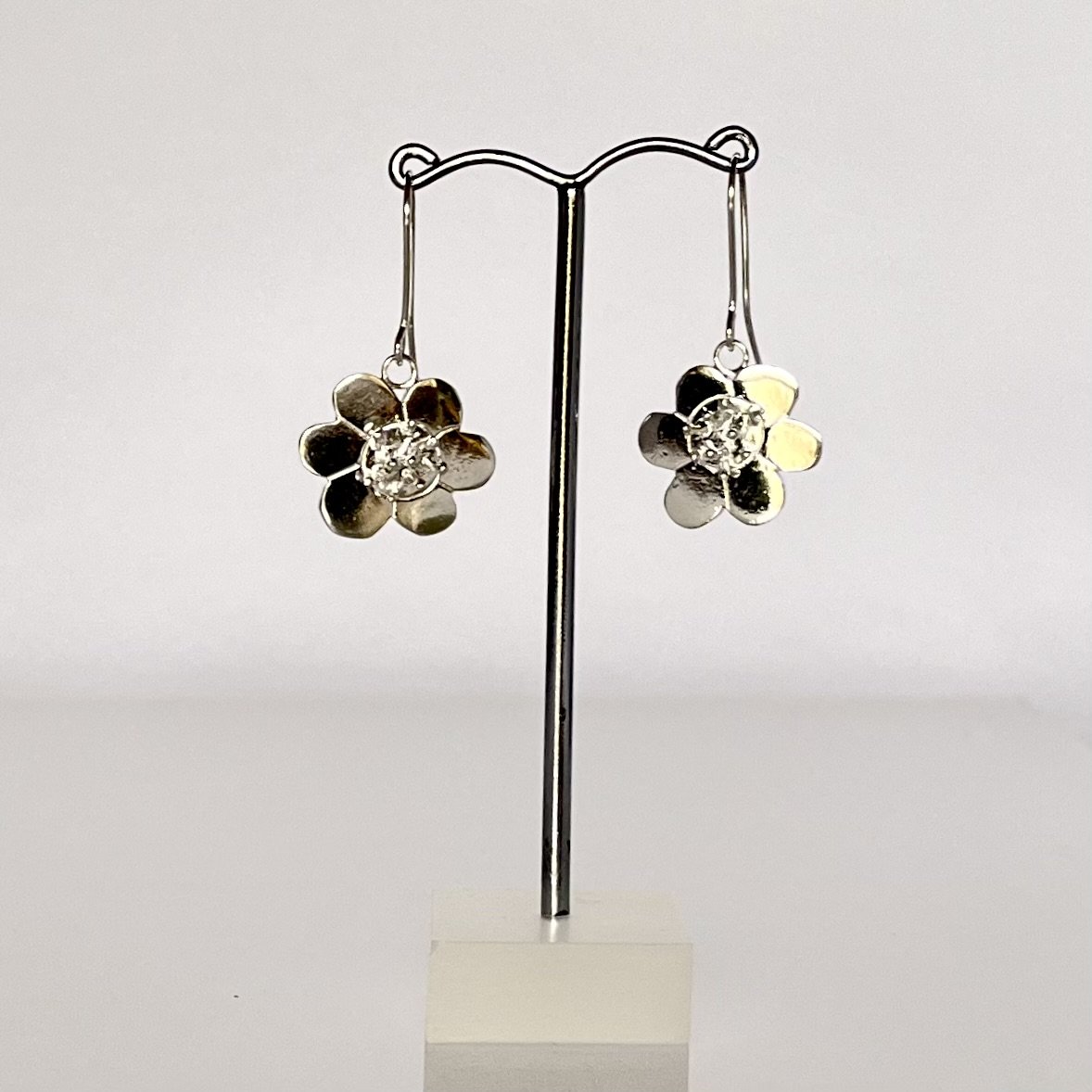 Solid sterling silver flower design earrings. Drop style earrings