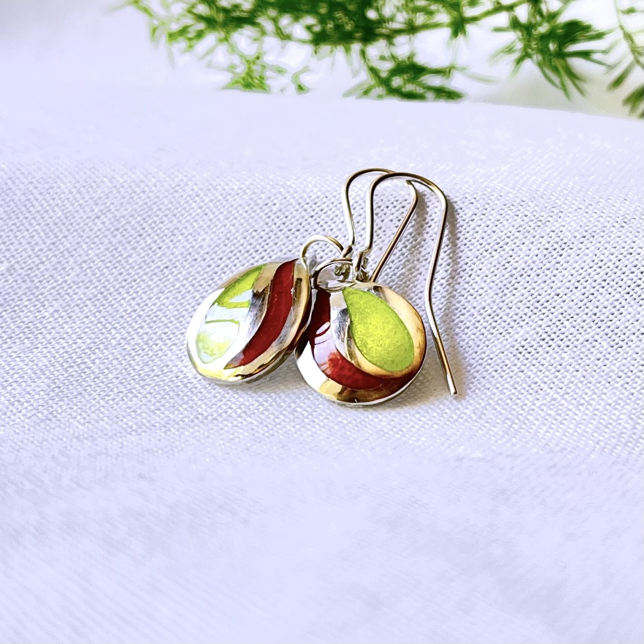 Sterling silver teardrop shaped earrings with citrus colour enamels. Drop style earrings