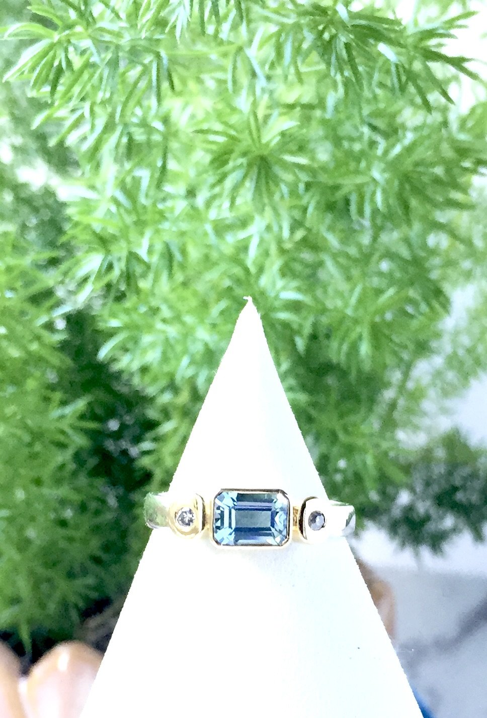 Yellow and white gold ring with emerald cut Topaz and round Diamonds
