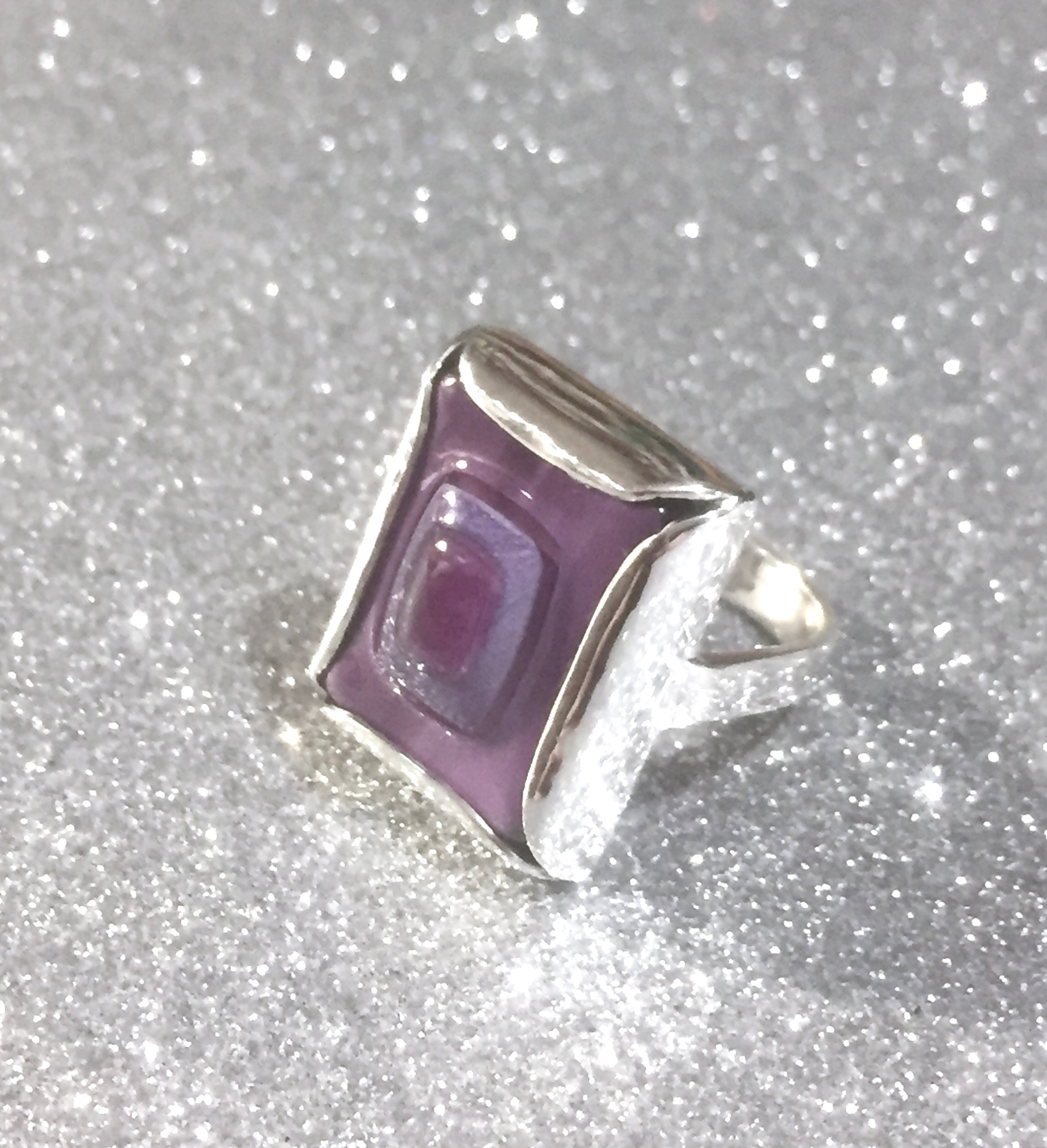 Customers own Murano glass tile. Custom made into asserting silver ring. Top view