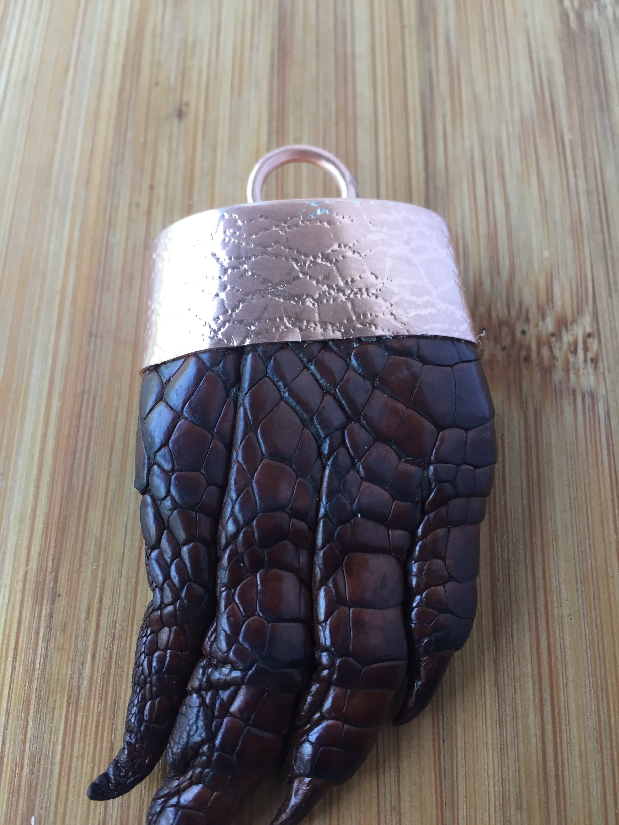 Customers own baby crocodile paw (the croc died from natual causes, not killed by a person)
Set into a copper setting to make a key ring