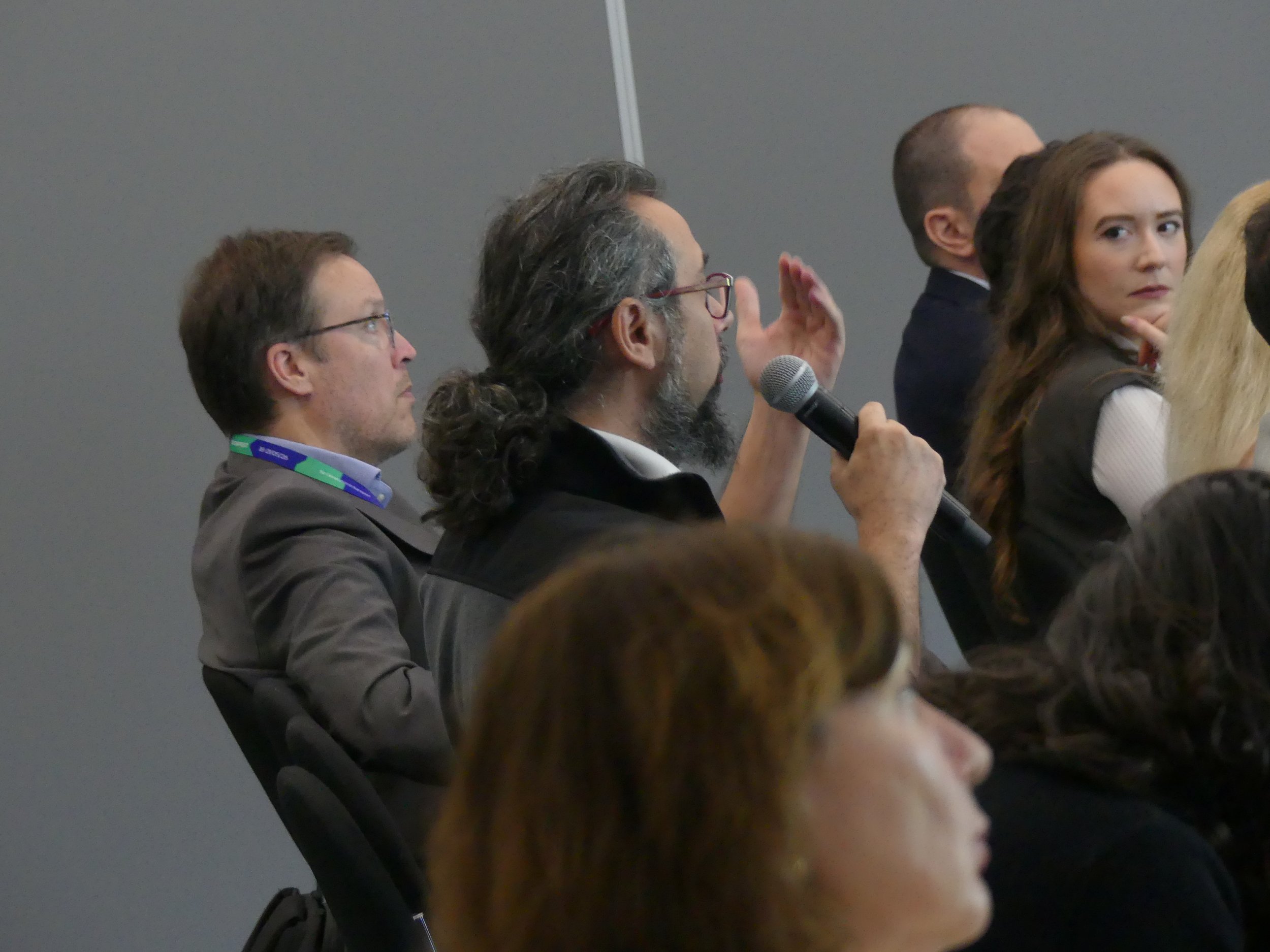 Audience questions and discussion during Panel III.