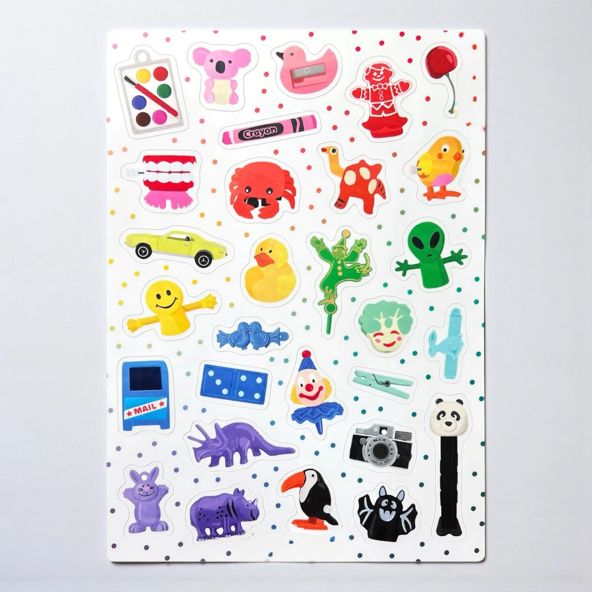 Eclectic sticker sheet with random vintage-style objects like aliens, ducks, dinosaurs, and candy.
