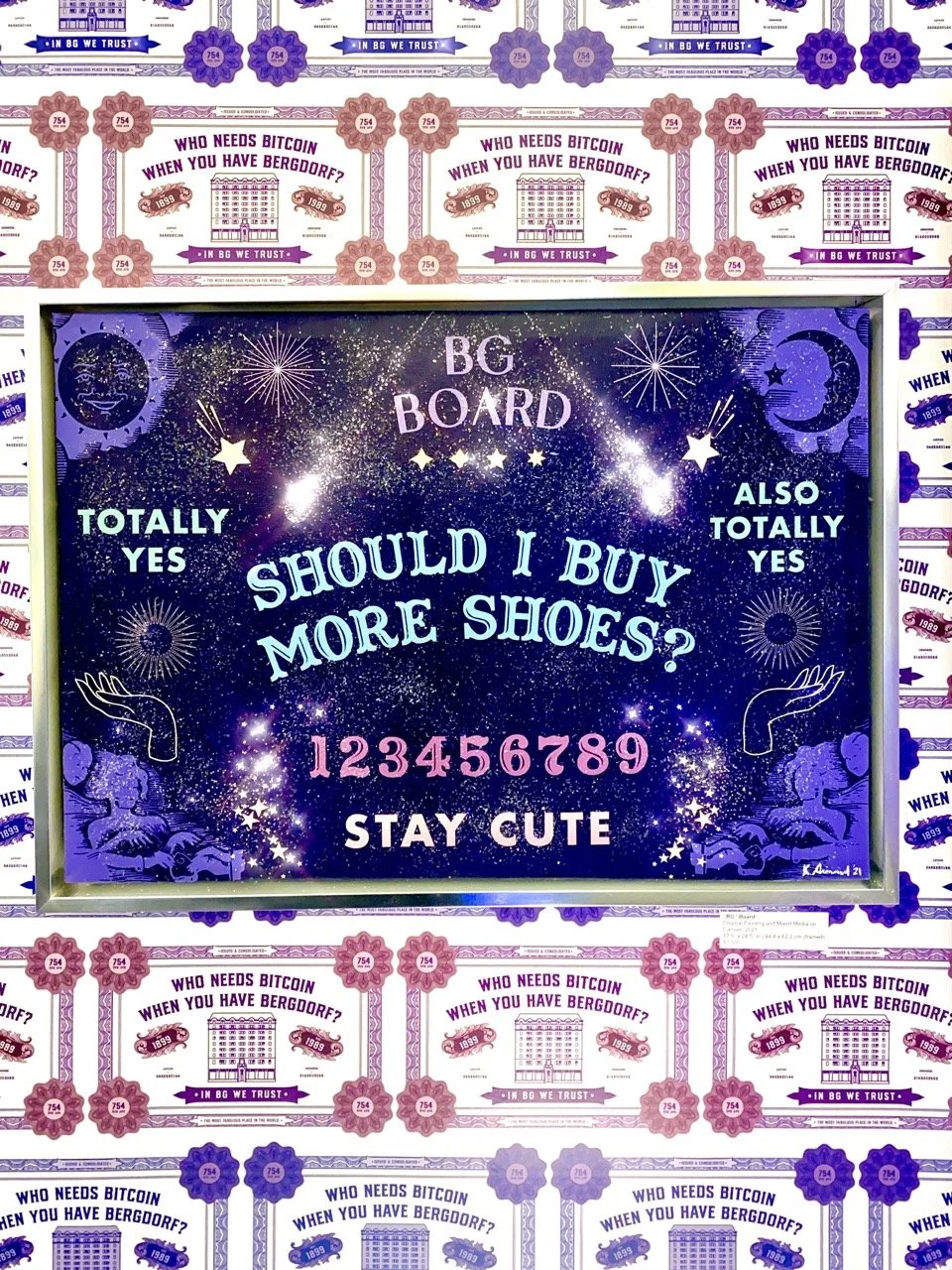 "Vibrant art piece featuring a cosmic-themed background with text ""Should I Buy More Shoes?"" flanked by ""Totally Yes"" on both sides. Below, numbers 1 to 9 and ""Stay Cute"" are displayed. Surrounding the artwork is wallpaper with ""Who Needs Bitc