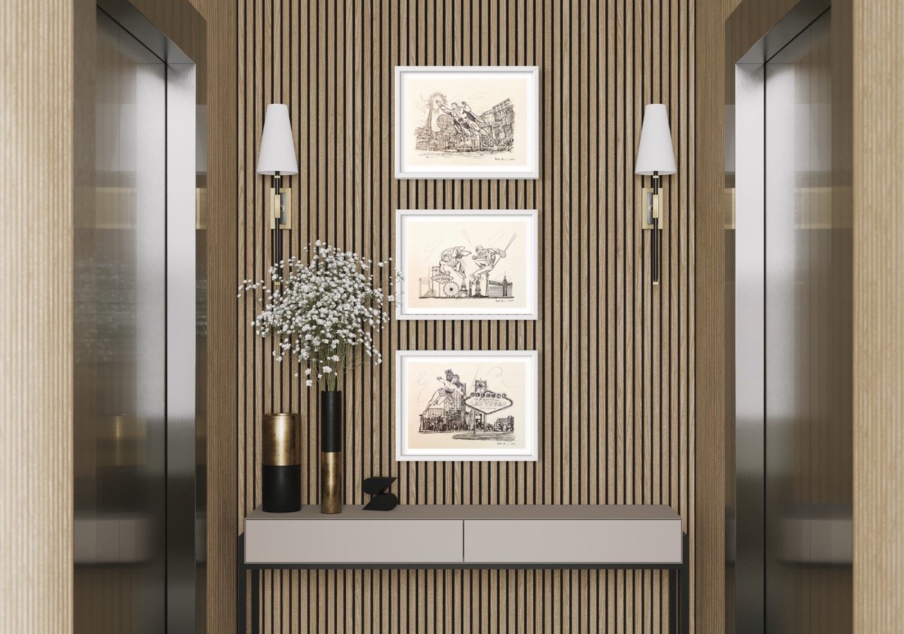 "Trio of framed pencil drawings featuring dynamic city scenes and superheroes, symmetrically arranged on a textured wall flanked by sleek wall sconces, above a shelf with decorative vases and flowers."