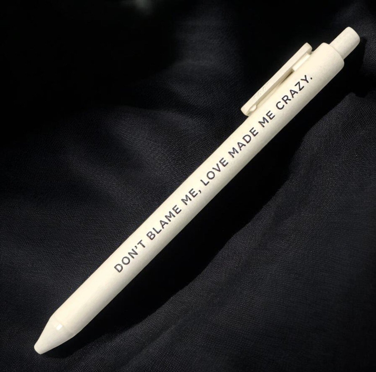 Cream-colored Taylor Swift pen with “DON’T BLAME ME, LOVE MADE ME CRAZY” lyric from the Reputation album.jpg