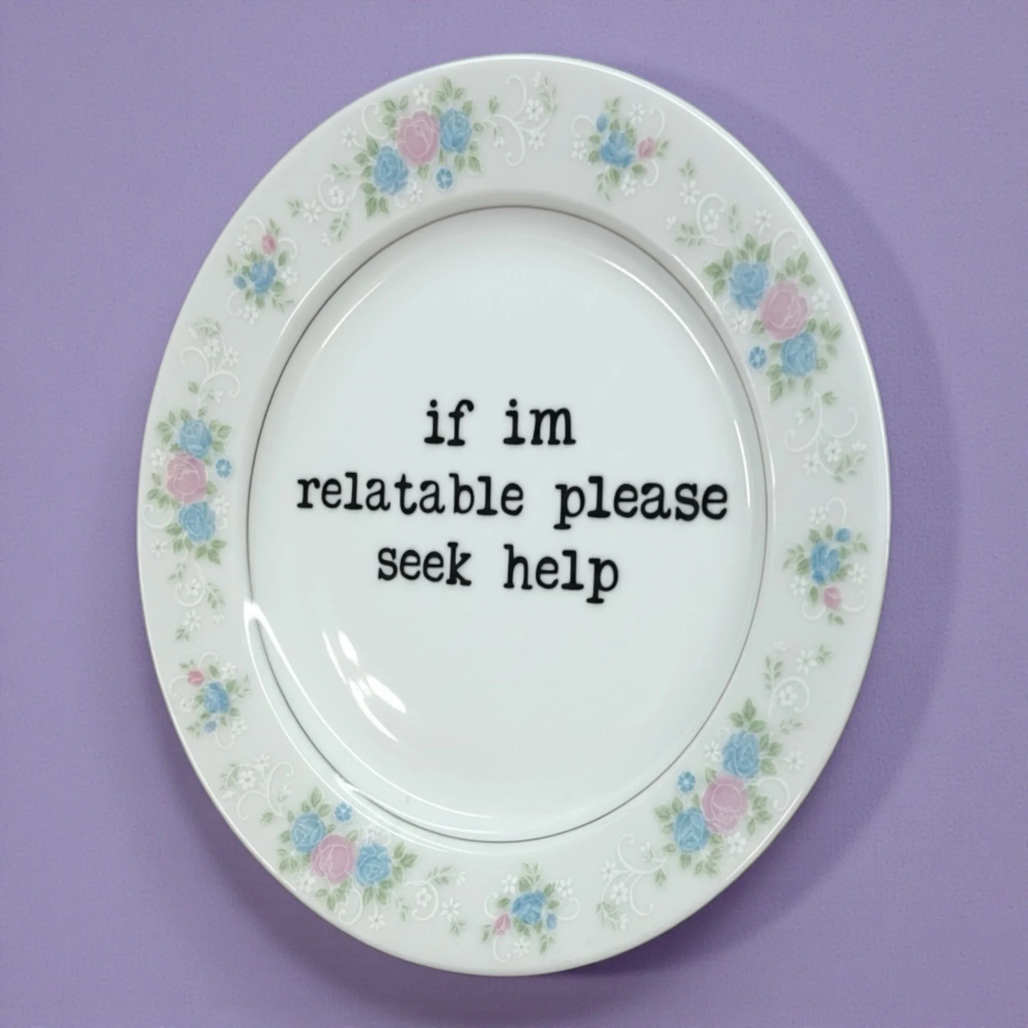 Funny vintage plate with dark humor quote and light pink and blue flower border.