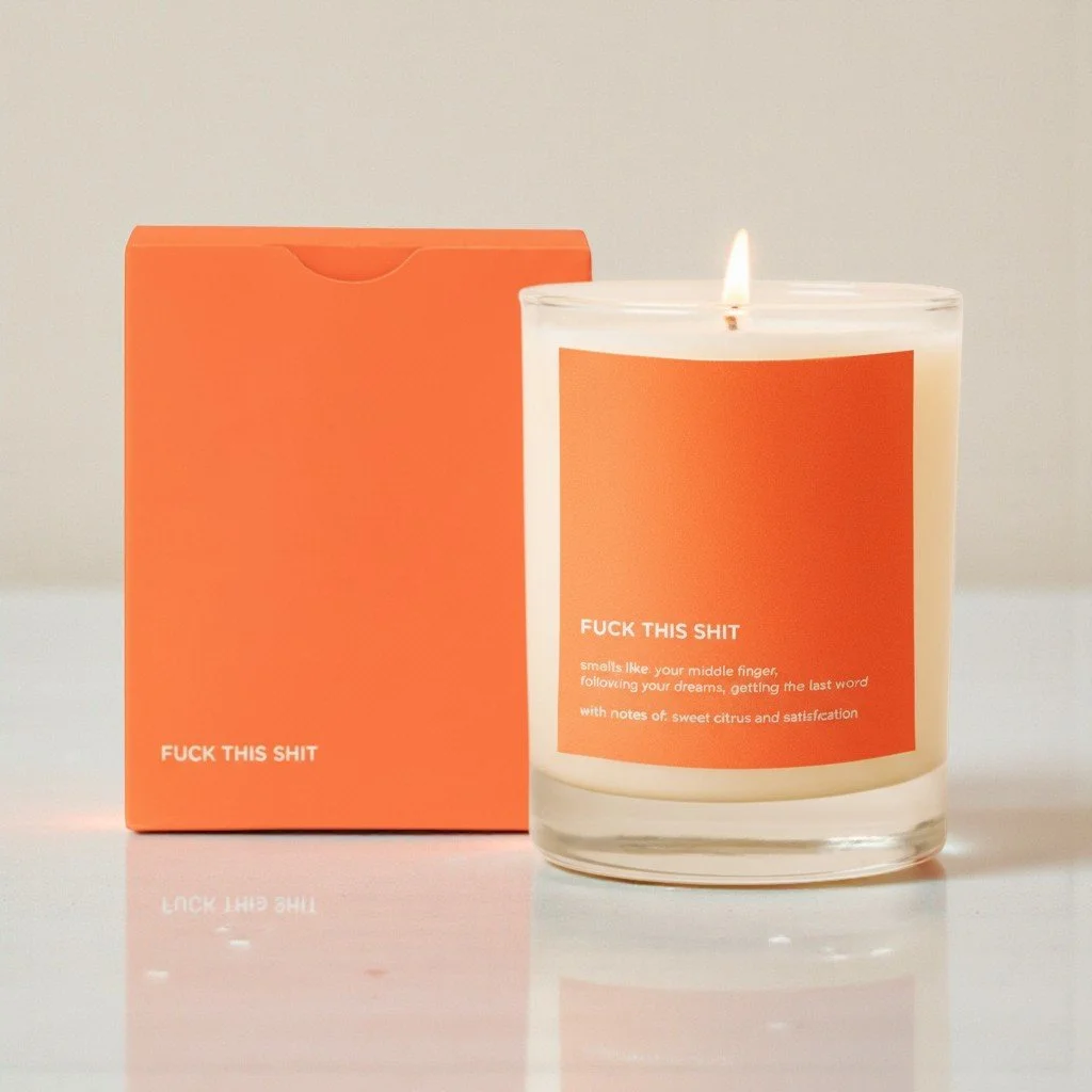 Modern novelty candle with adult humor messaging and a sweet citrus scent for burnout relief.