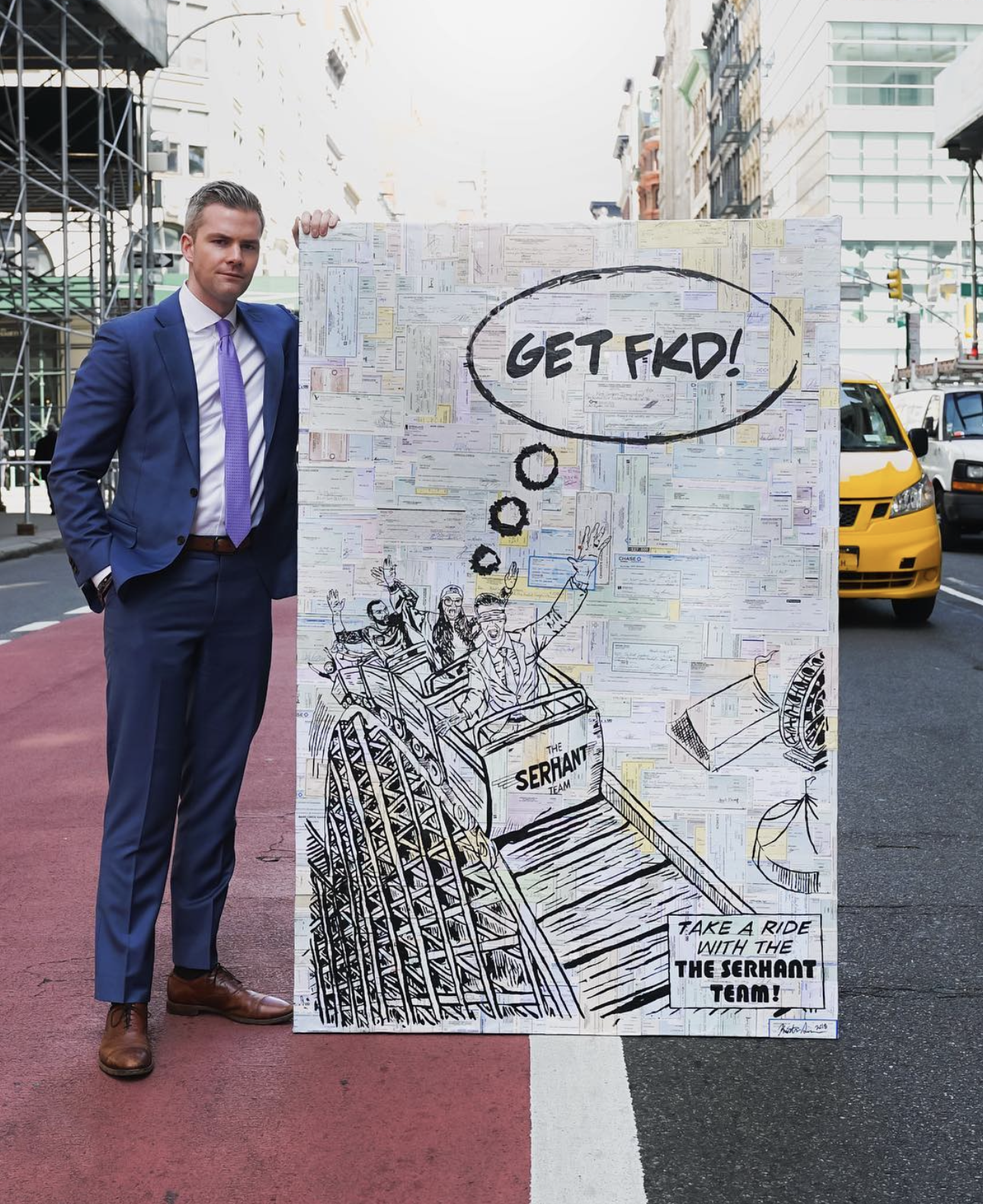 Man in a blue suit holding a large, colorful artwork on a city street. The art features a roller coaster with people shouting "GET FKD!" in a speech bubble, and "Take a ride with The Serhant Team!" at the bottom. Taxis and buildings are visible in th