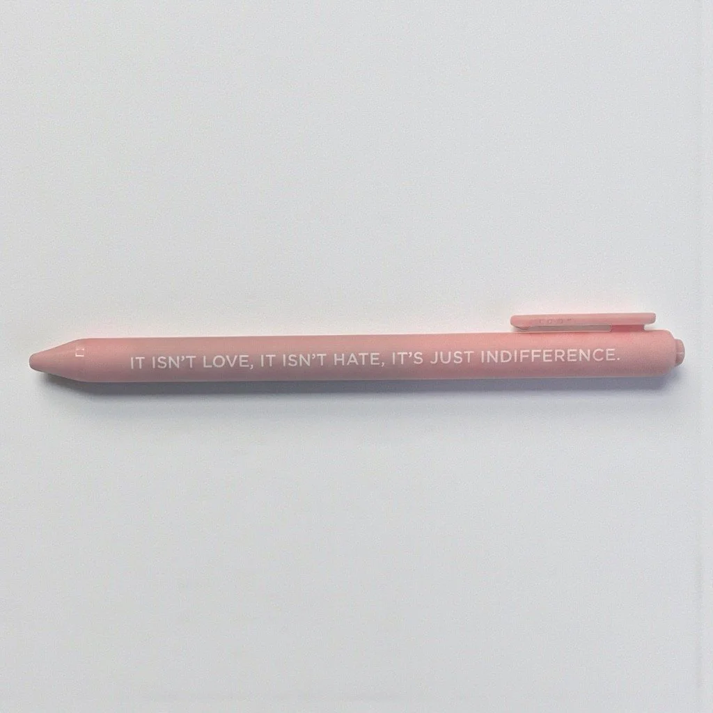 Minimalist pink pen featuring Lover-era lyric quote from Taylor Swift.