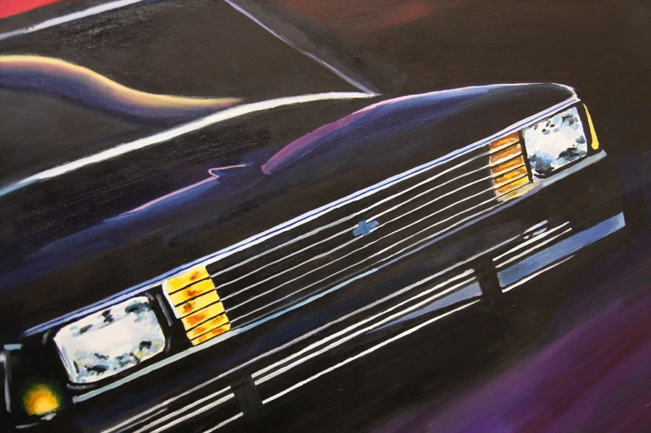 Close-up painting of a sleek, black car's front grille and headlights, featuring reflective highlights and vibrant colors. The artwork captures the car in motion with dynamic light effects.