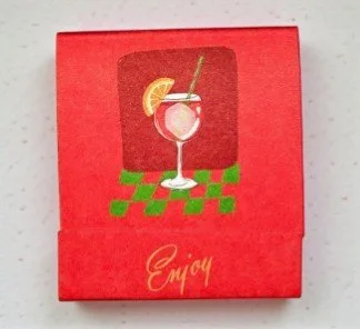 Whimsical cocktail matchbook designed with aperol spritz artwork and playful packaging.