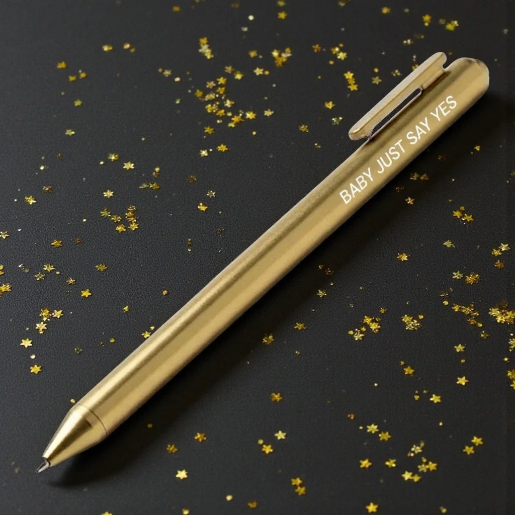 Romantic Taylor Swift-inspired pen with “BABY JUST SAY YES” printed on gold, perfect for hopeless romantics.