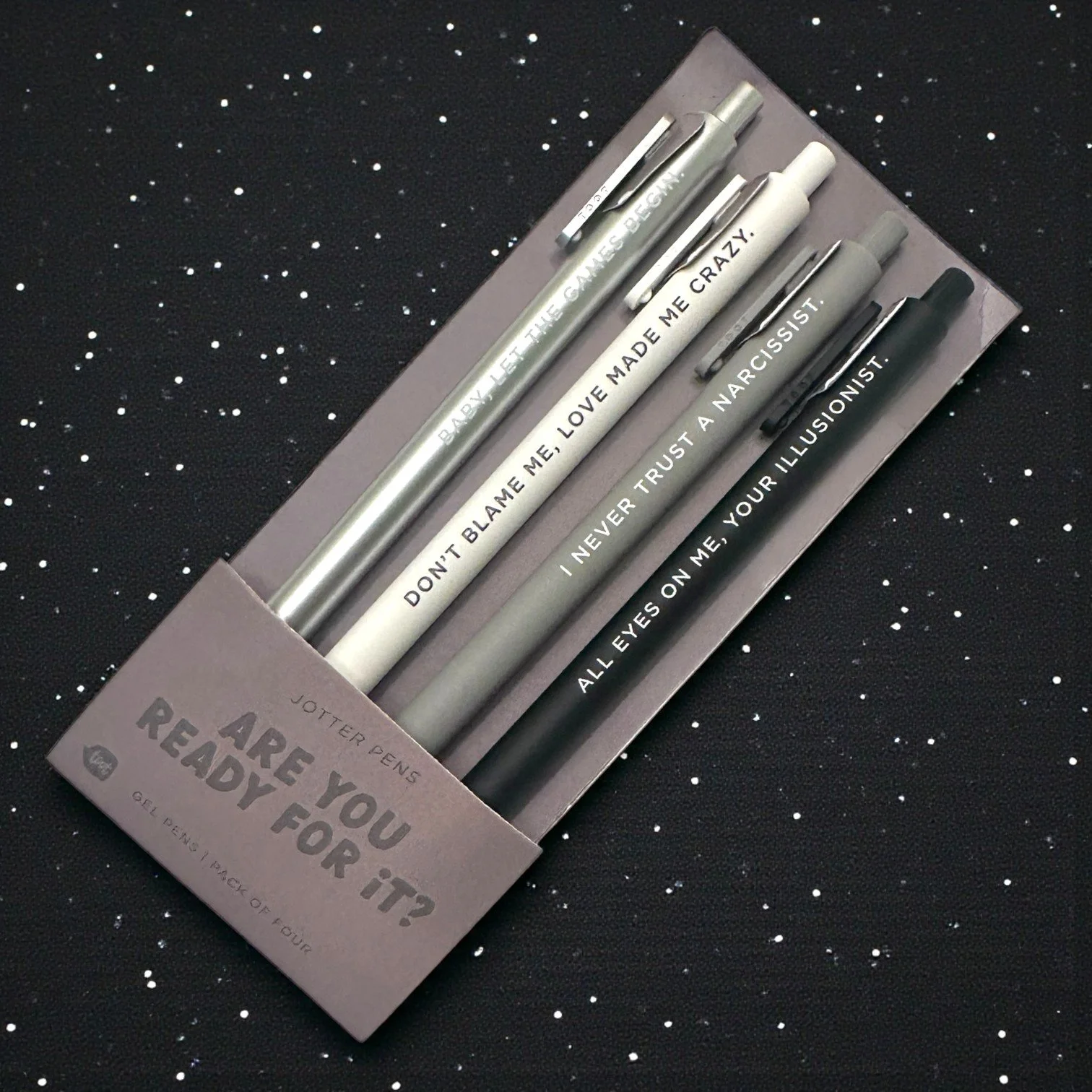 Reputation-themed gel pen set with moody black and grey design and iconic Taylor Swift lyric quotes.