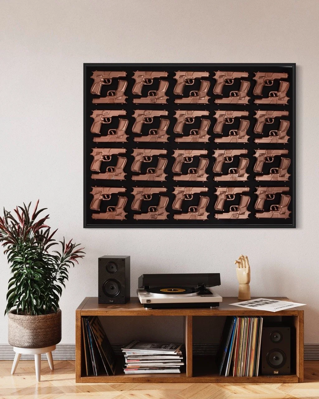 "Stylish living room featuring a large pop art painting of brown guns arranged in a grid on a black background. Below the artwork, a wooden console holds a turntable, speakers, and magazines. A potted plant adds a touch of greenery to the space.
"
