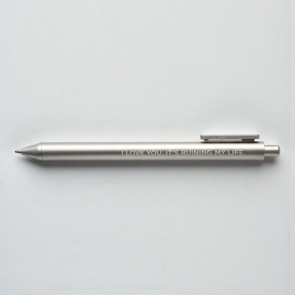 Taylor Swift-inspired silver pen with sad lyric-style engraving for Tortured Poets Department fans.