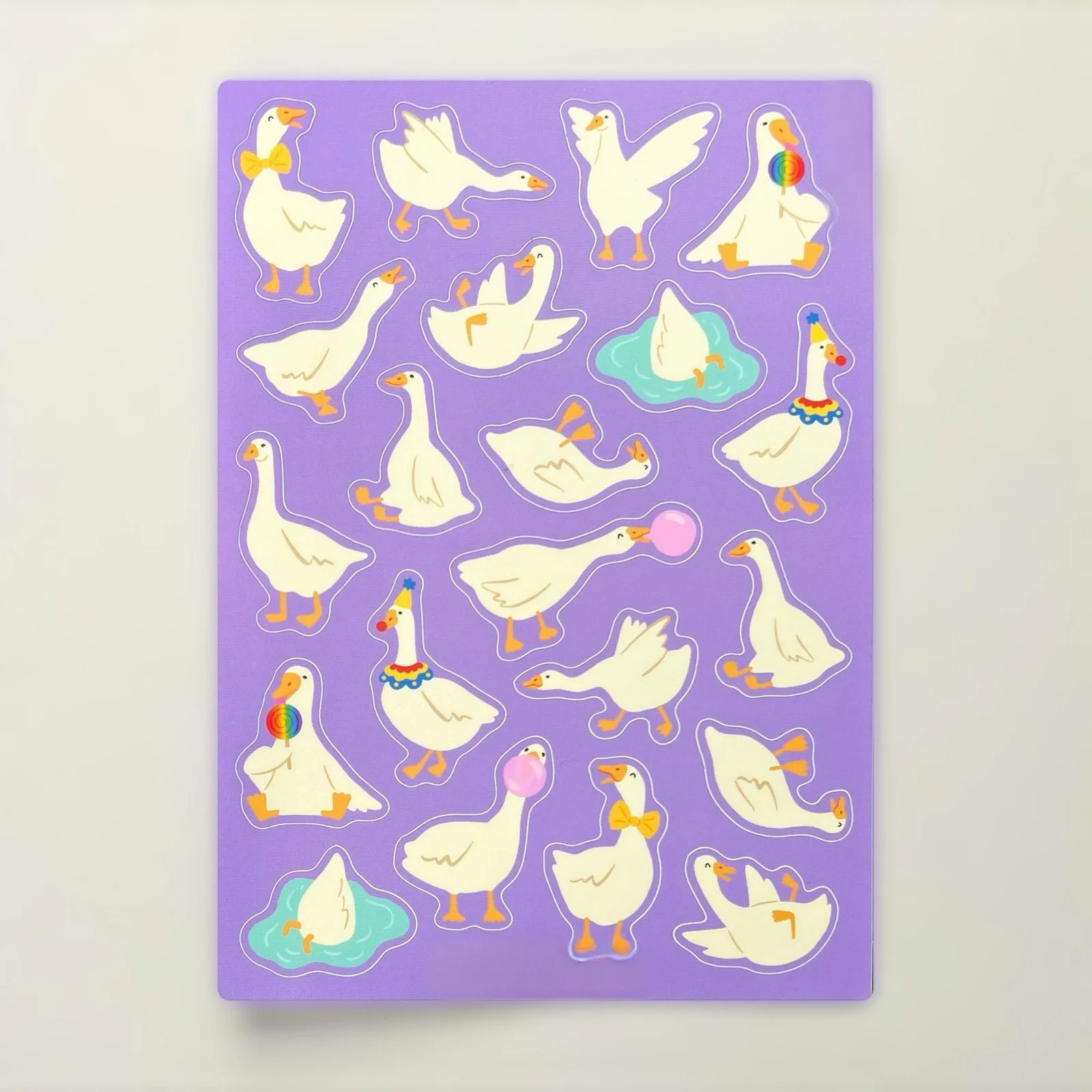 Whimsical goose sticker sheet with geese blowing bubblegum, wearing bowties, and striking silly poses.